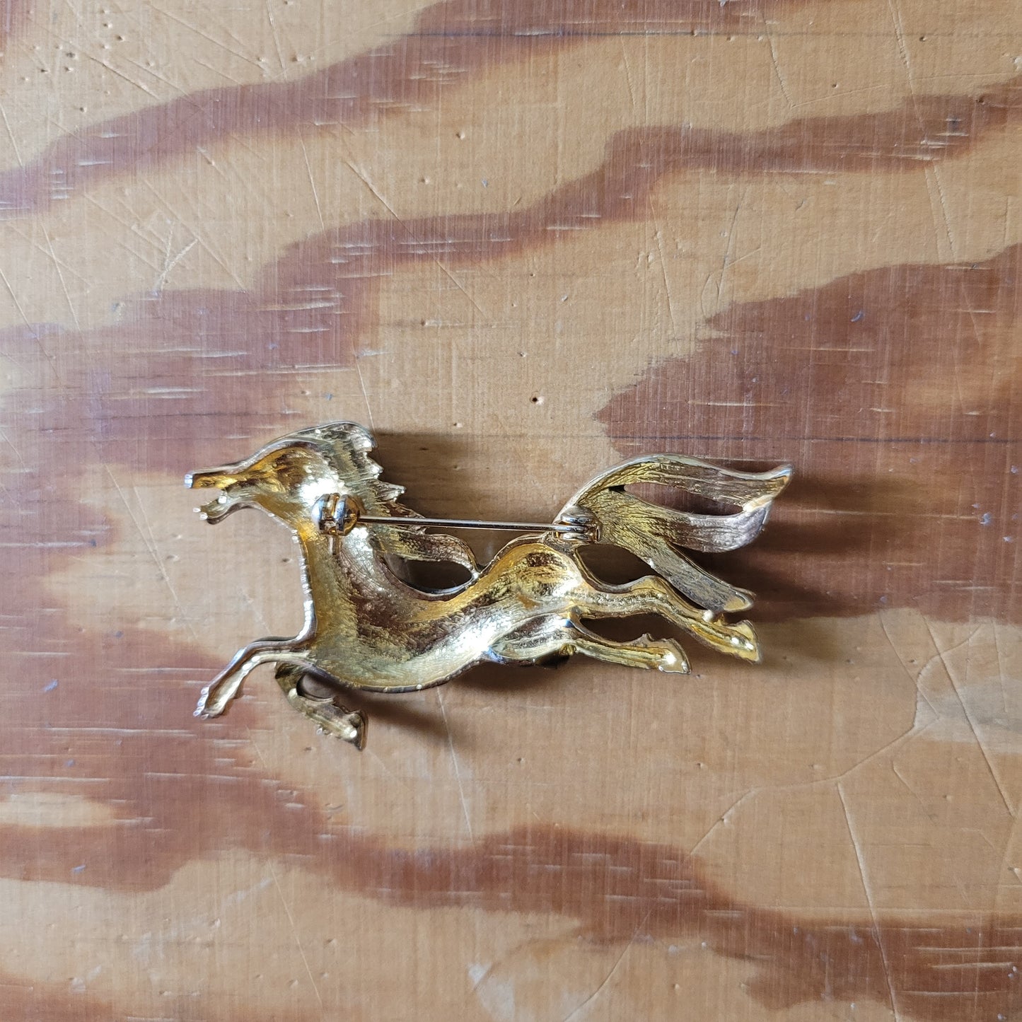 Vintage brown enamel galloping horse brooch