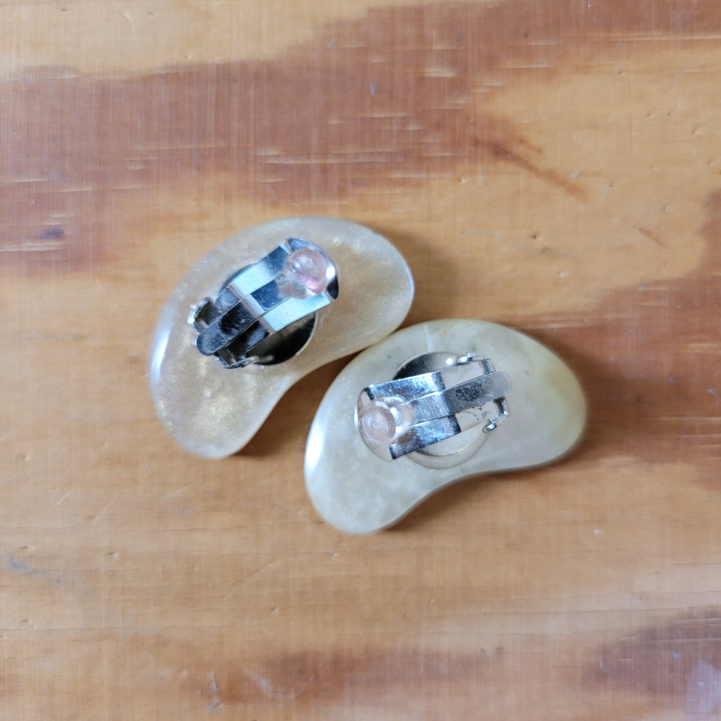Large 1960s mother of pearl kidney bean shaped flat clip-on earrings