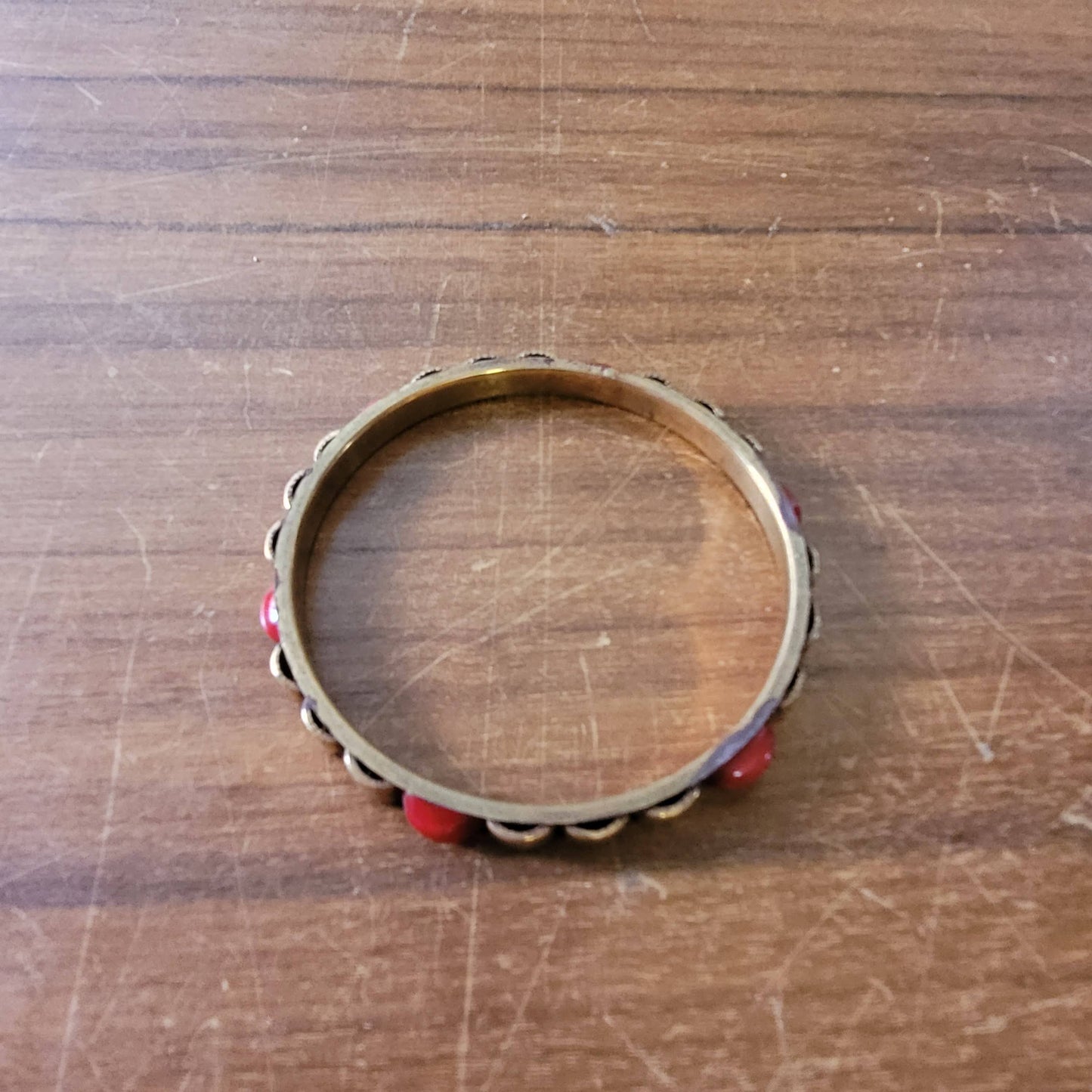 1970s/80s Moroccan-style brass bangle with red cabochon detail