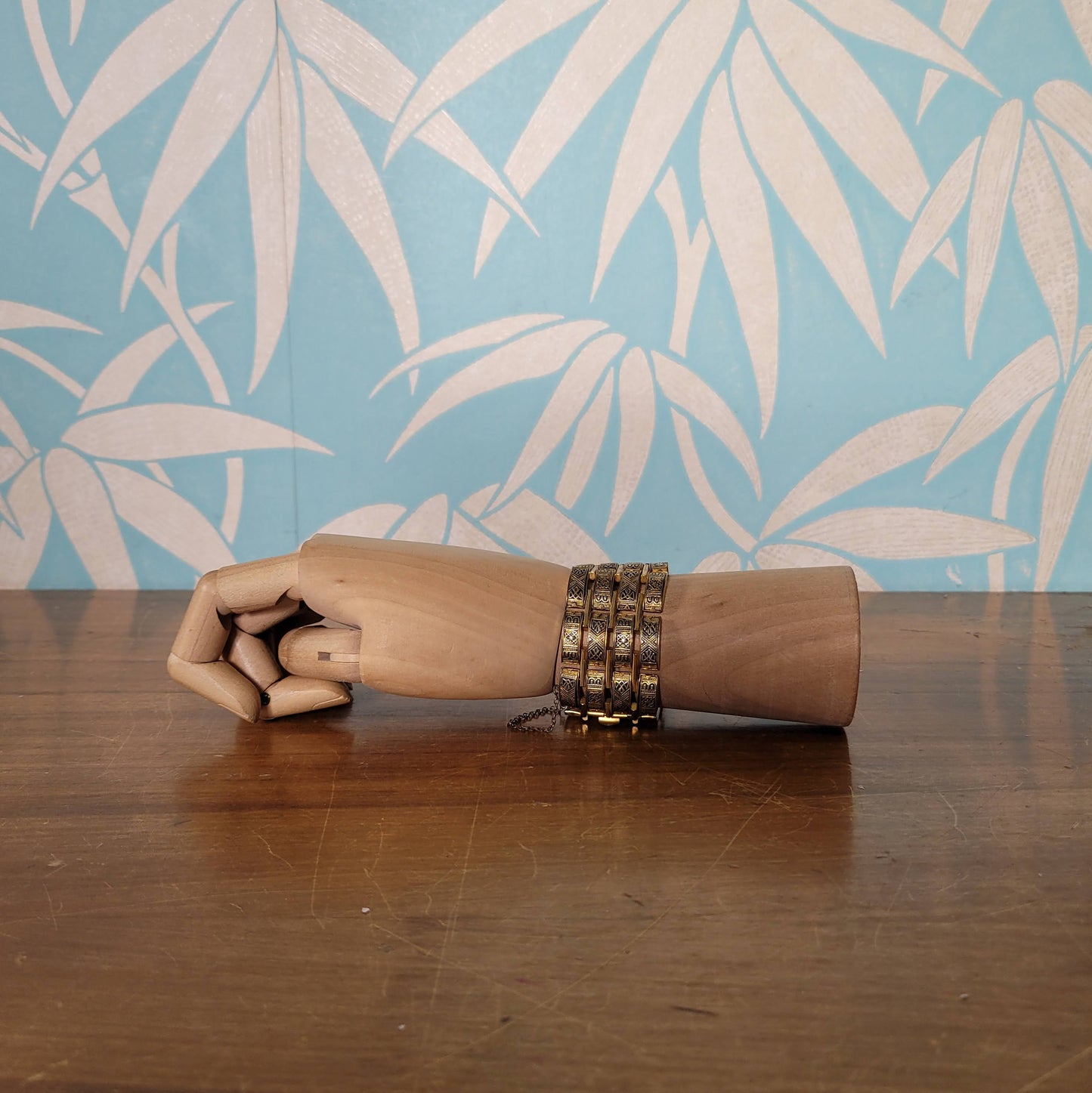 Vintage Damascene gold-tone four row tank bracelet with safety chain.