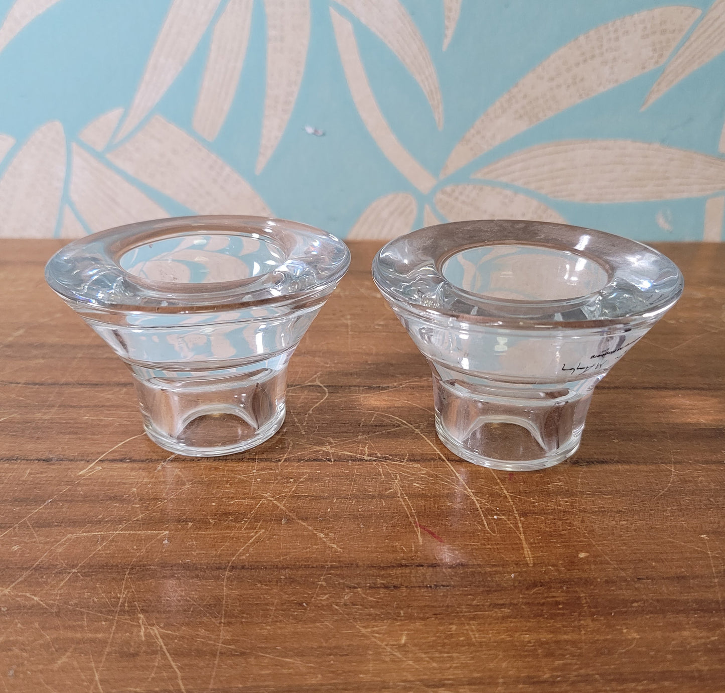 Two collectable Hagberg glass reversible tea light/candle holders