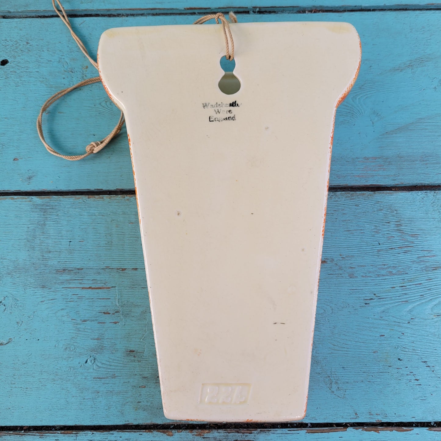 Art Deco Wadeheath Ware orange/rust ceramic wall planter with handpainted floral rim, stamped 224