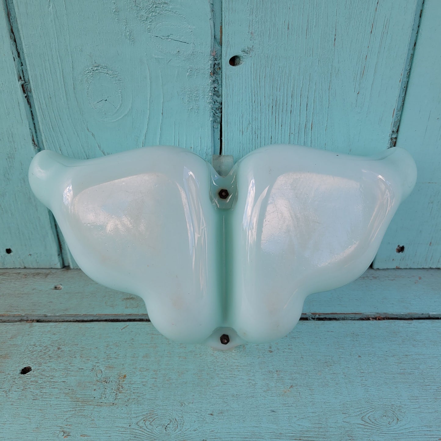 circa. late 1940s pale turquoise acrylic butterfly shaped trinket dish with scroll-shaped handle