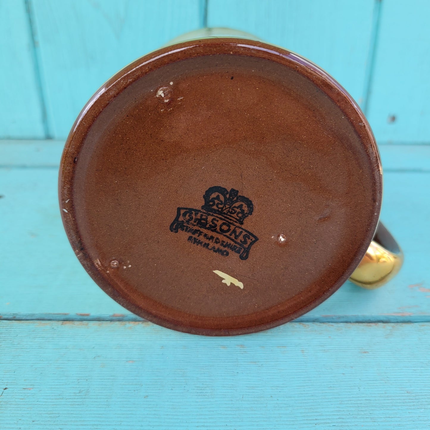 Collectable 1950s Gibsons china tankard with copper gilt edging and football players motif