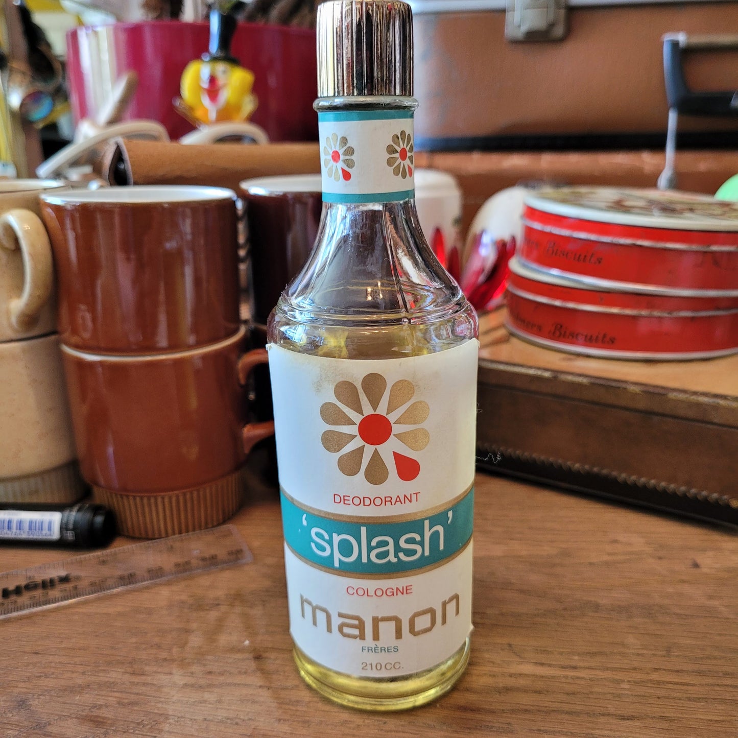 Two 1960s/70s crocheted poodle eau de toilette bottle covers with contents