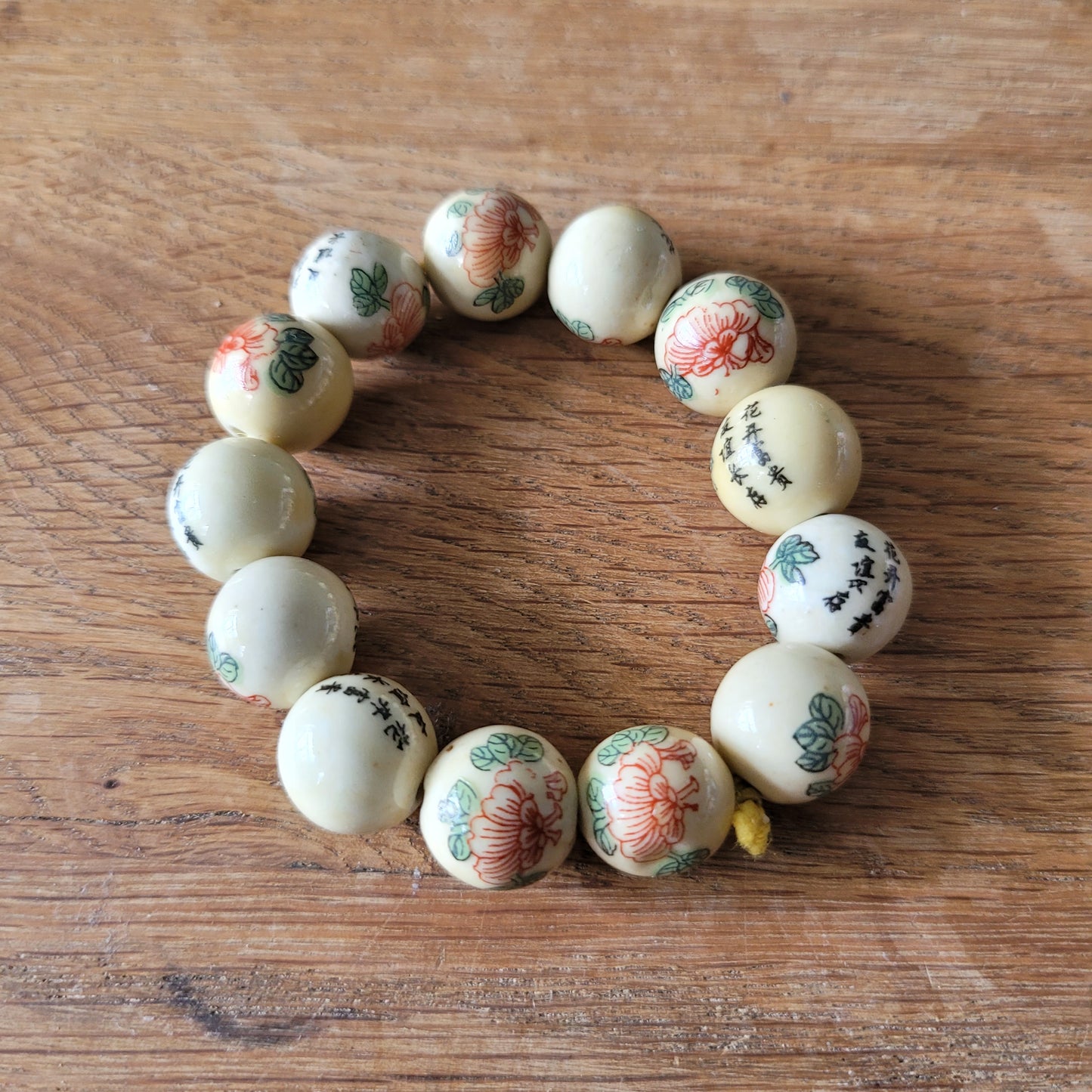 Vintage Chinese-style ceramic bead bracelet with floral motif and calligraphy detail