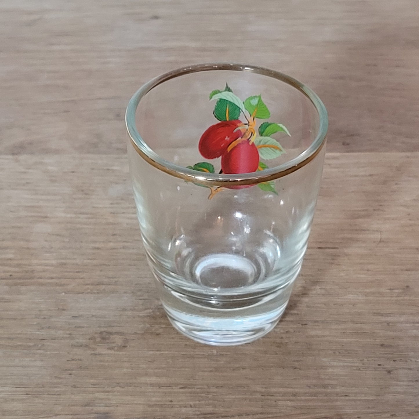 Set of five 1970s fruit patterned shot glasses with gilt trim