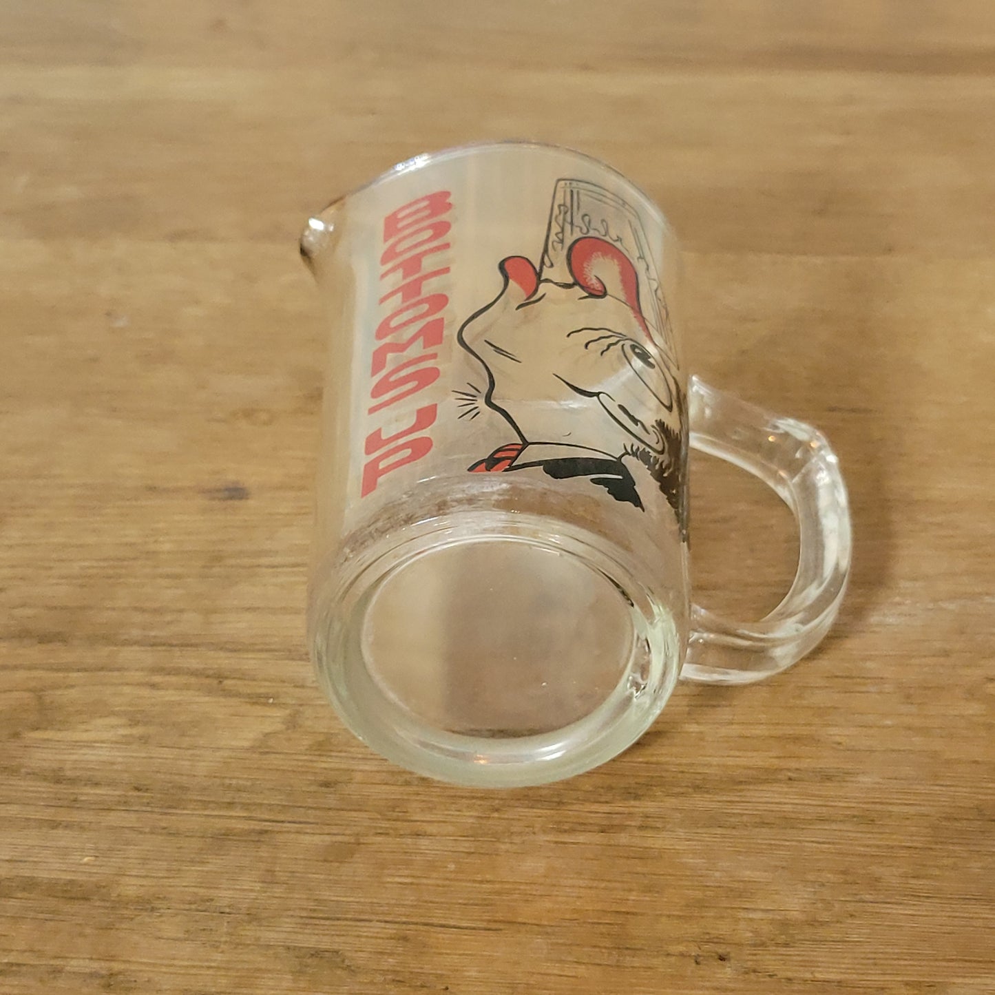 Mid-century ‘Bottoms Up’ glass cocktail mixer jug with drunken man design