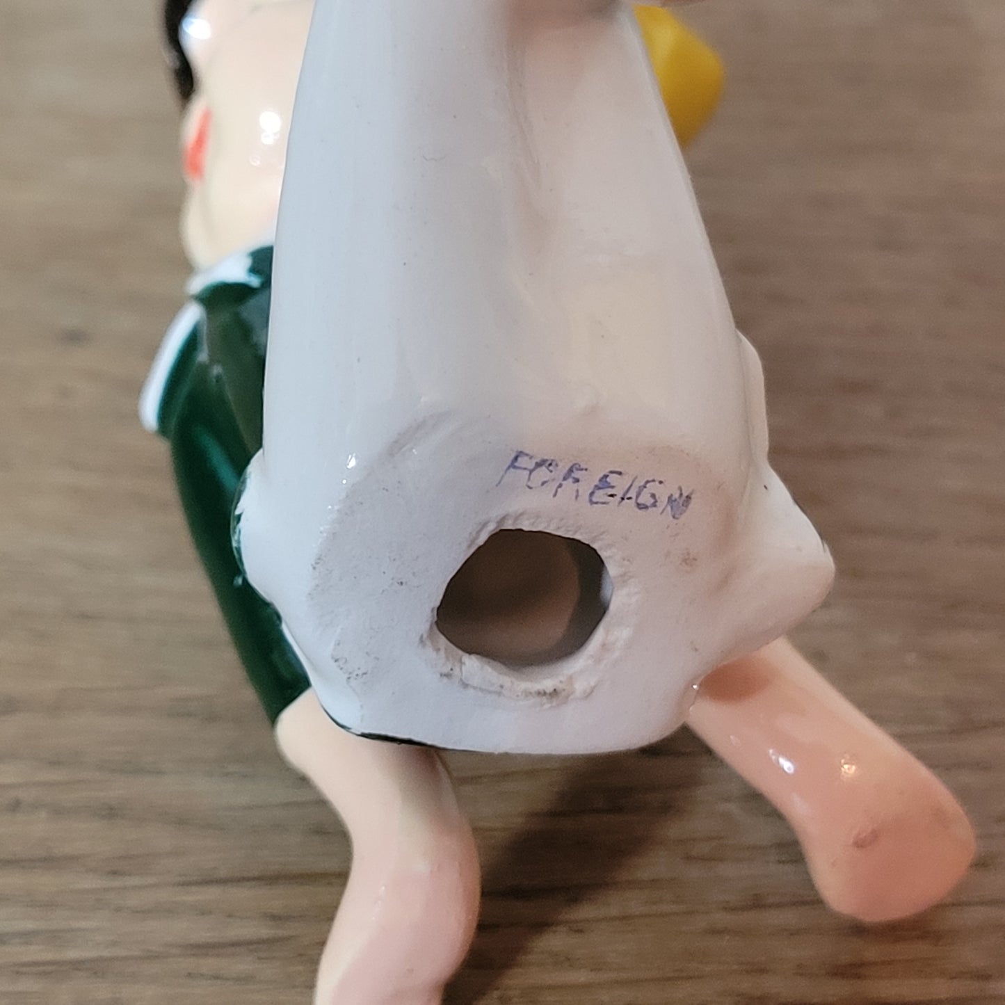 circa. 1960s ceramic pixie figurine with yellow bird