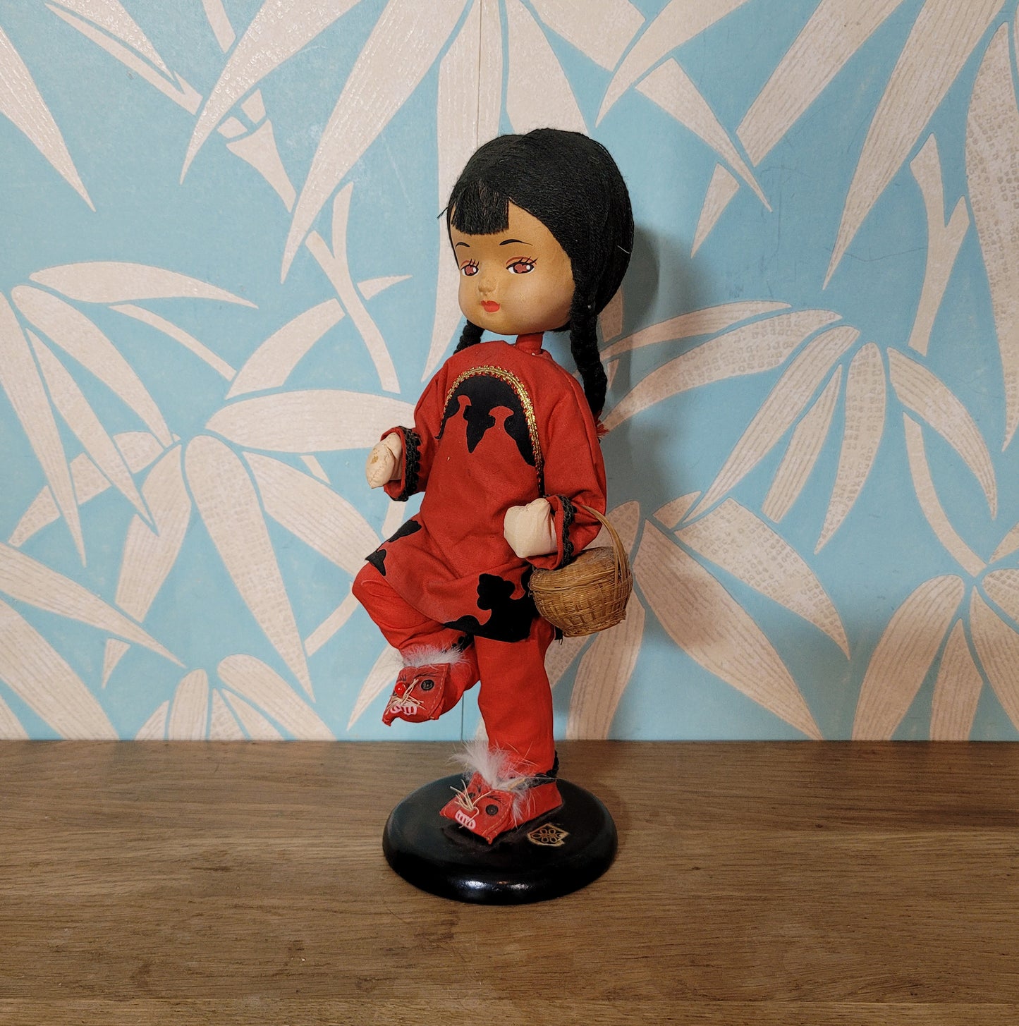 Vintage oriental pose-doll carrying basket, in traditional costume