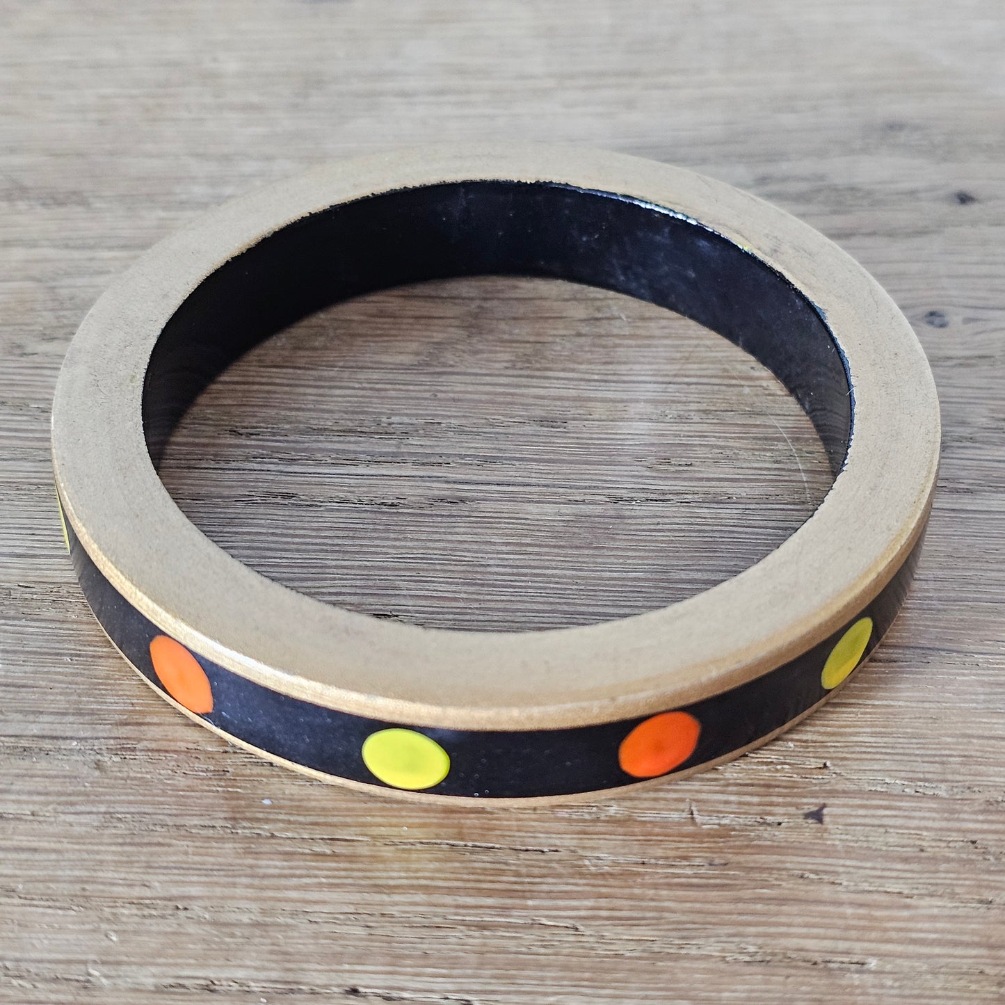 1970s hand-painted black/gold wooden bangle with yellow & orange dot detail