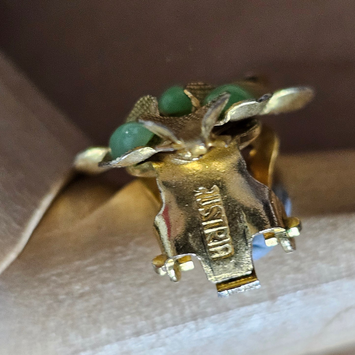 1960s Austrian gold-tone leaf & green glass cabochon clip-on earrings