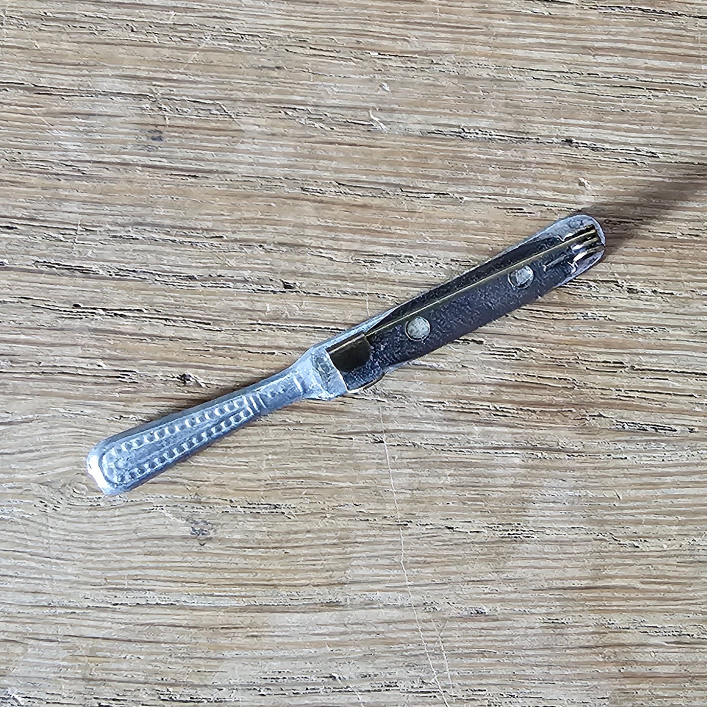Home-made brooch using vintage minature butter knife