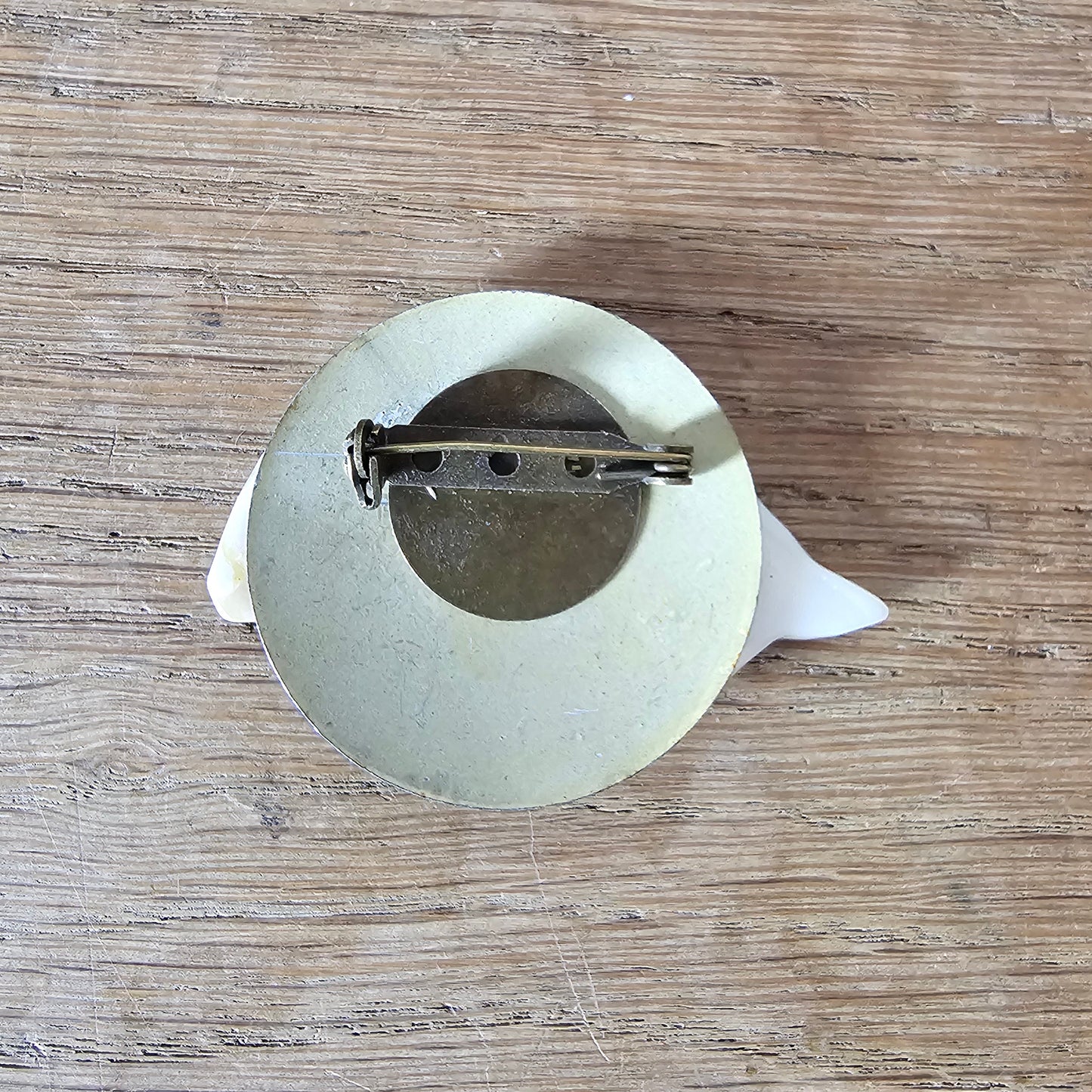 Home-made brooch using vintage Mother of Pearl fish & metal patterned disc earring back