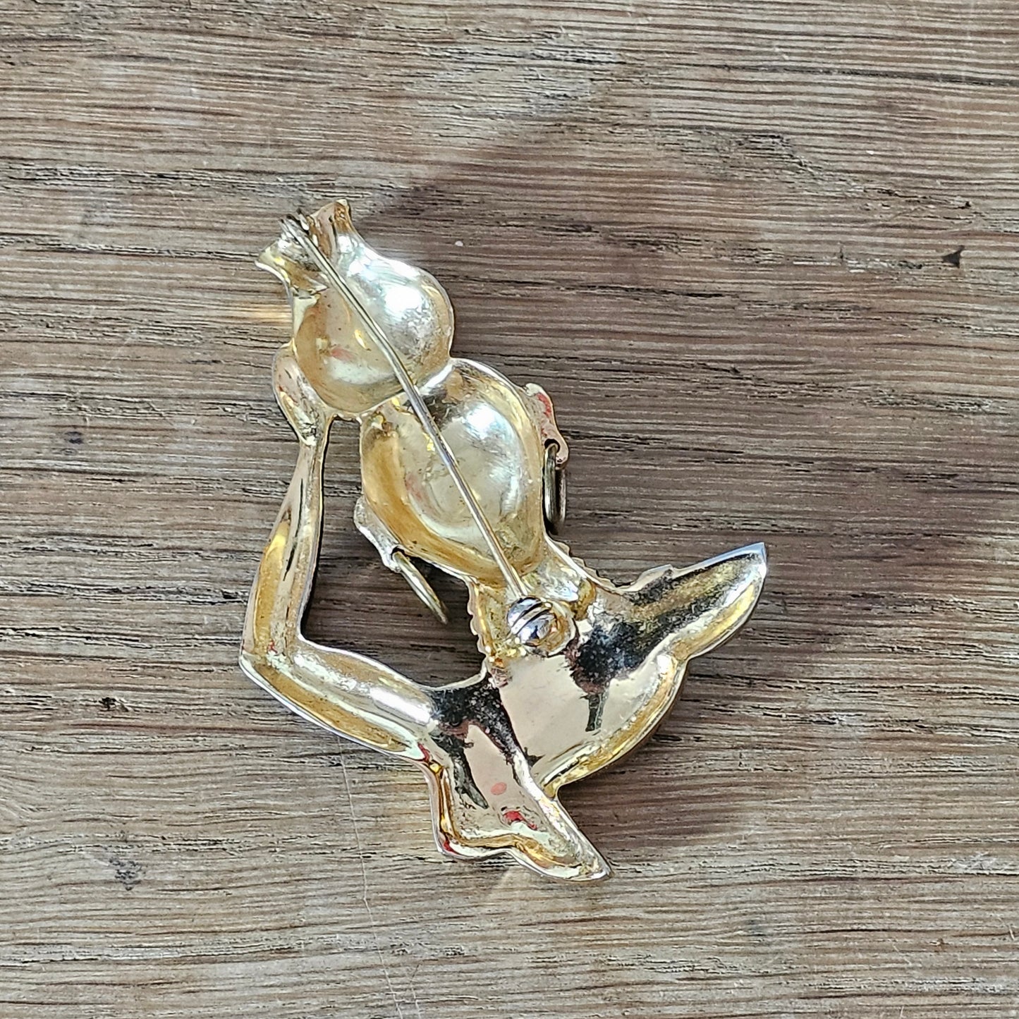 Mid-century gold-tone figural tribal bust brooch with turquoise seed bead accents