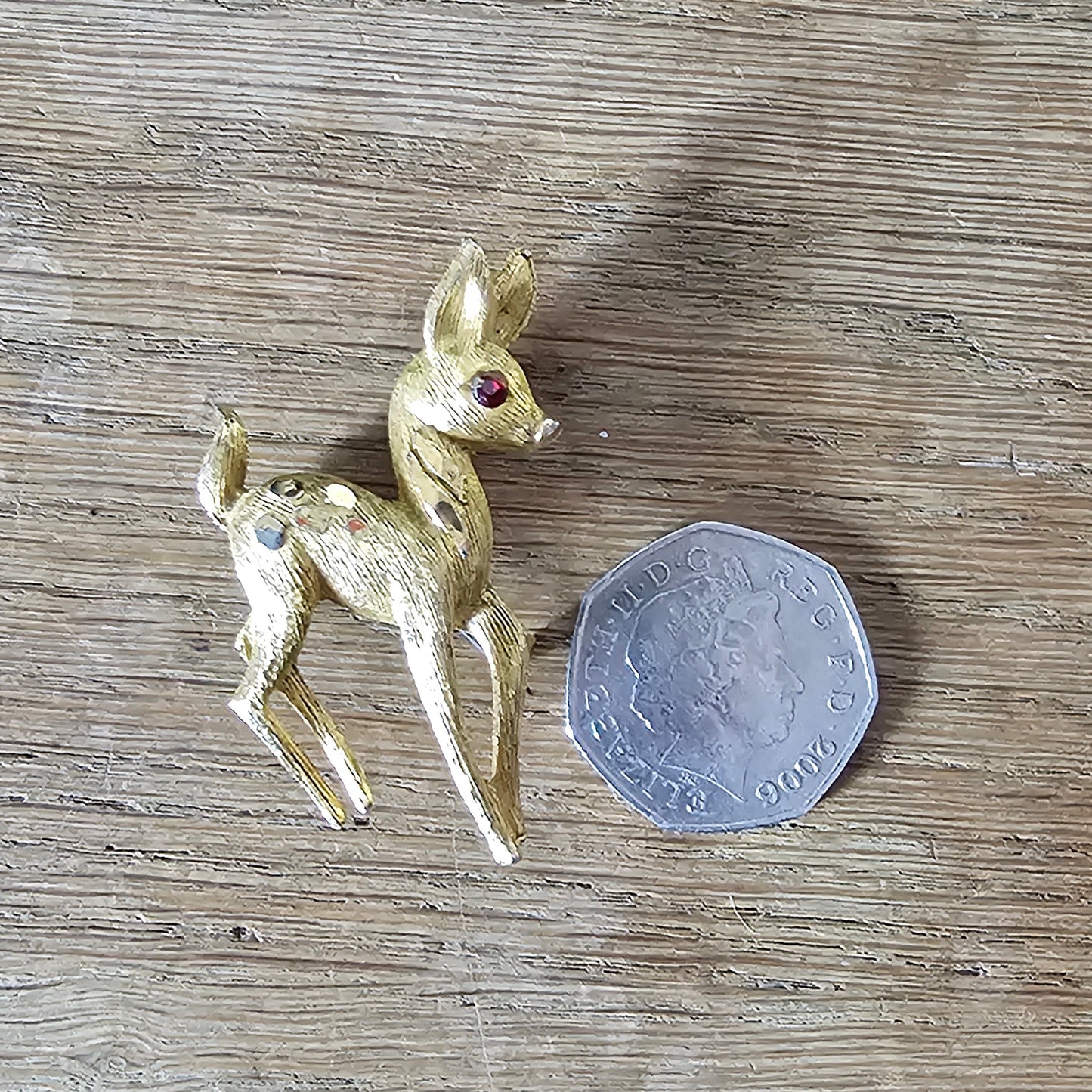1950s gold-tone fawn brooch with red rhinestone eye