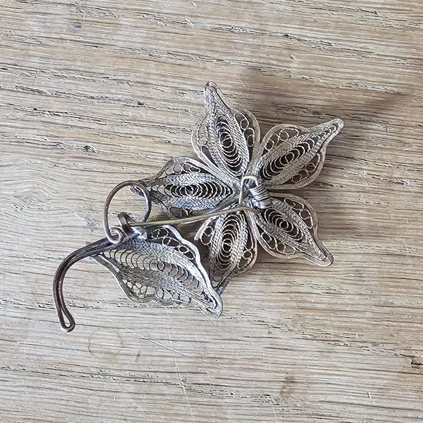 Antique copper filigree floral brooch