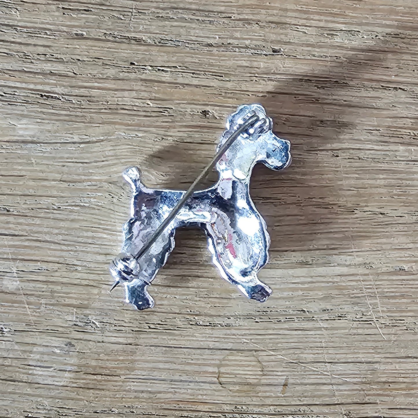 1950s silver-tone faux marcasite poodle dog brooch with rhinestone eye