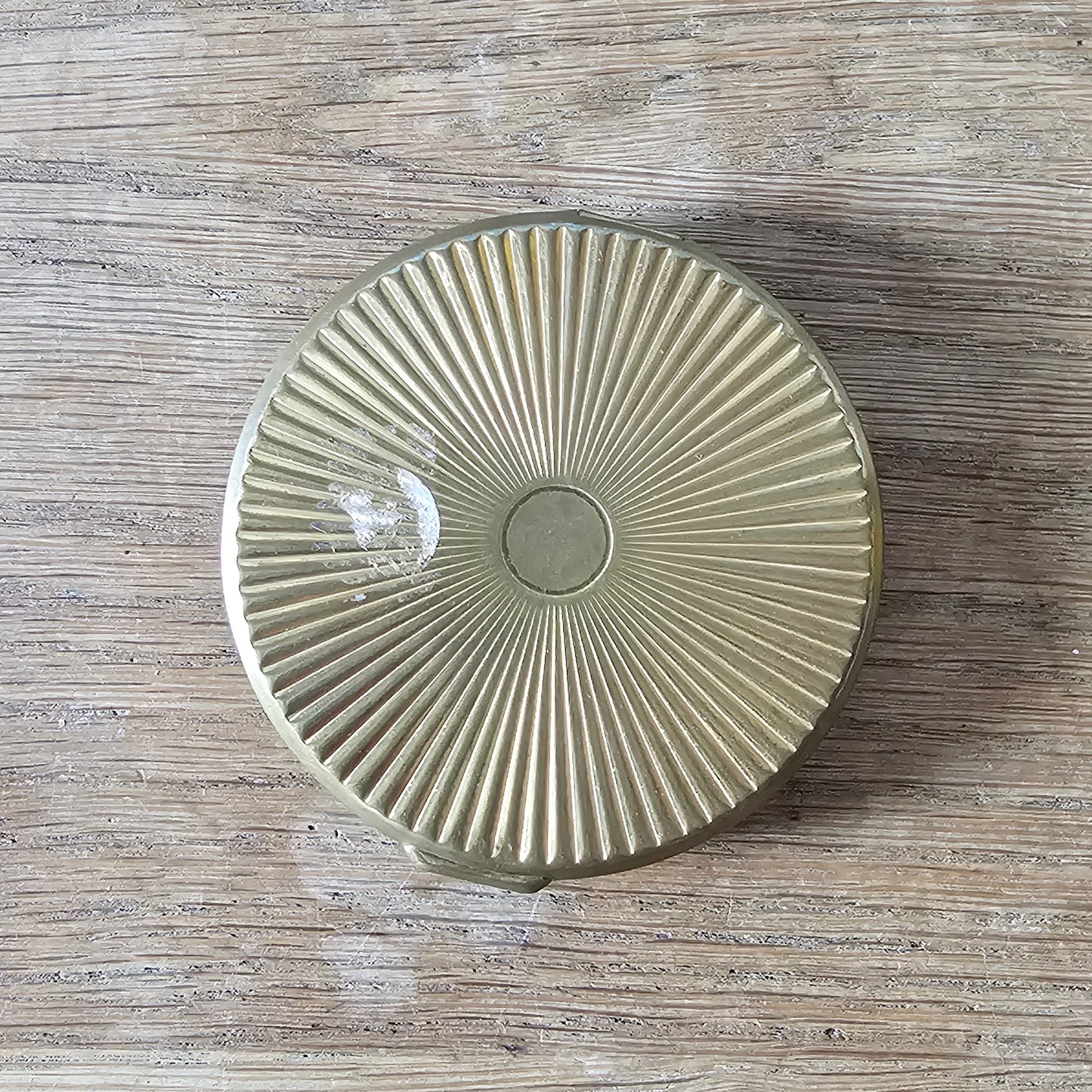 1960s gold-tone powder compact with mod fashion illustration design