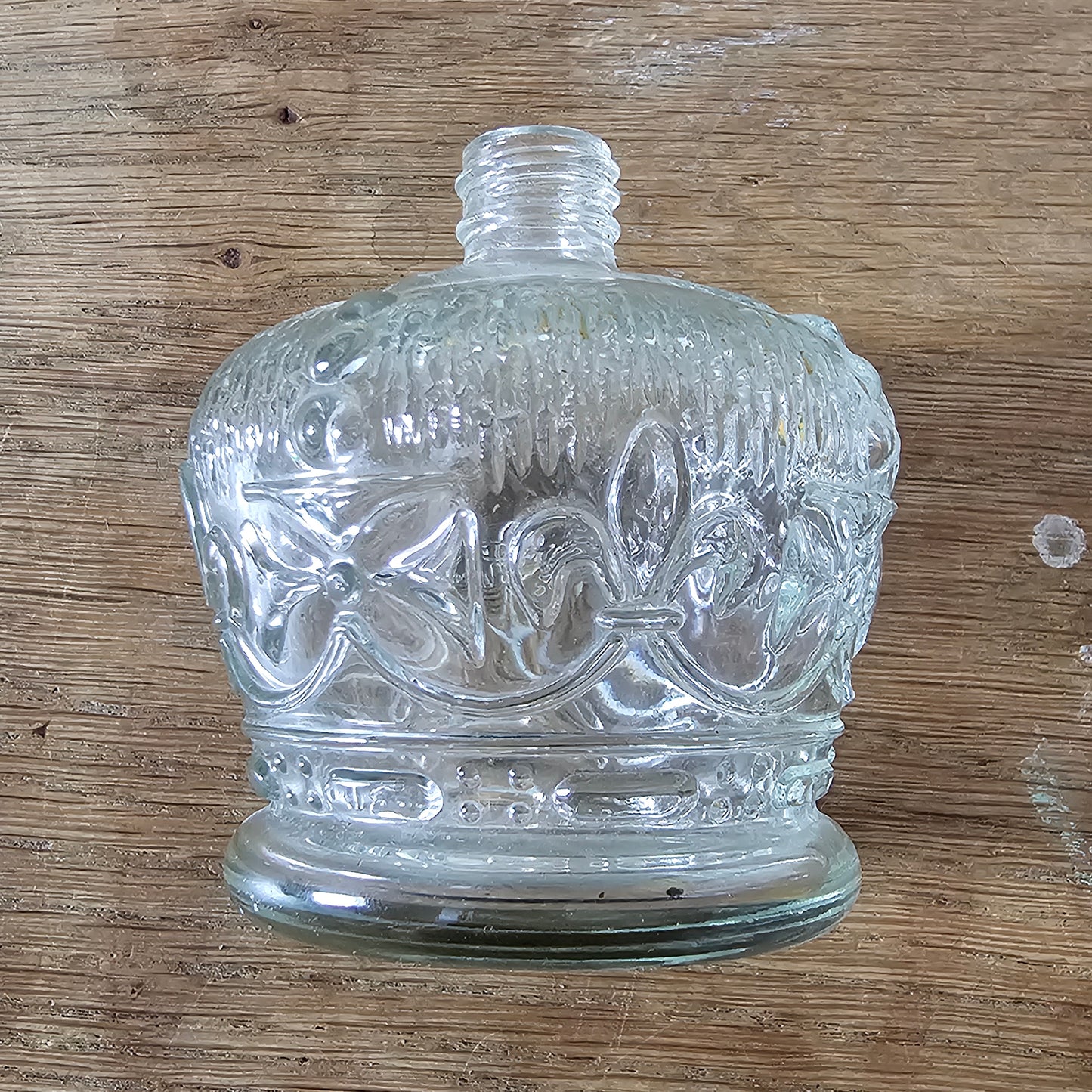 1960s/70s fleur-de-lys moulded glass perfume bottle with gold-tone screw top