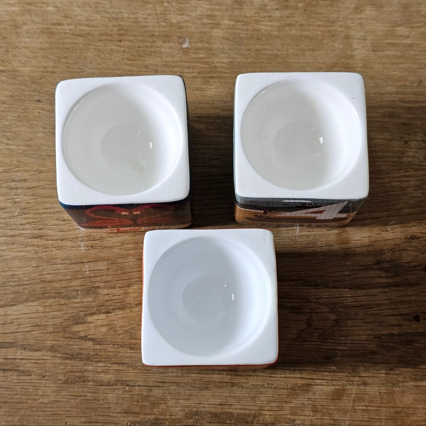 Set of 3 Paul Thurlby illustrated numbered egg cups (No. 1, 2 & 4)