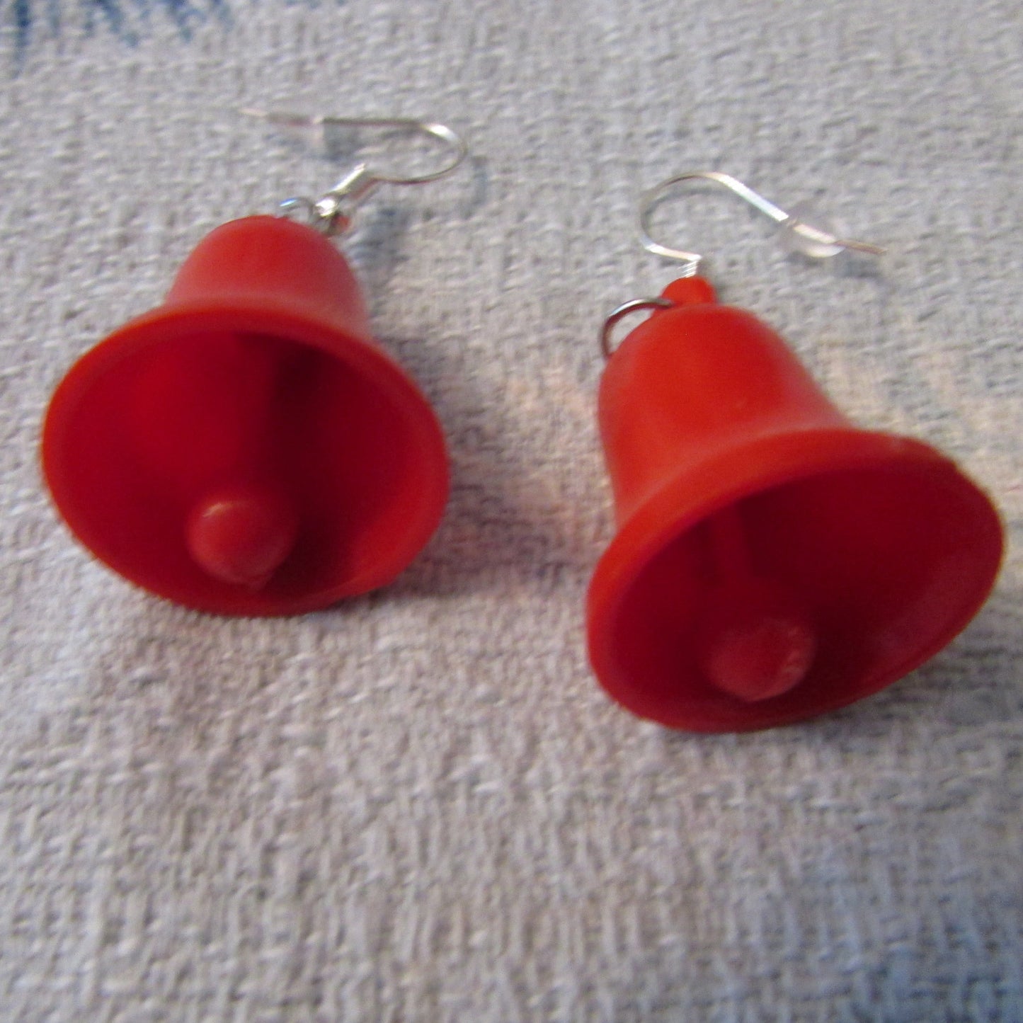 Kitsch home-made earrings made using vintage plastic bell cake toppers