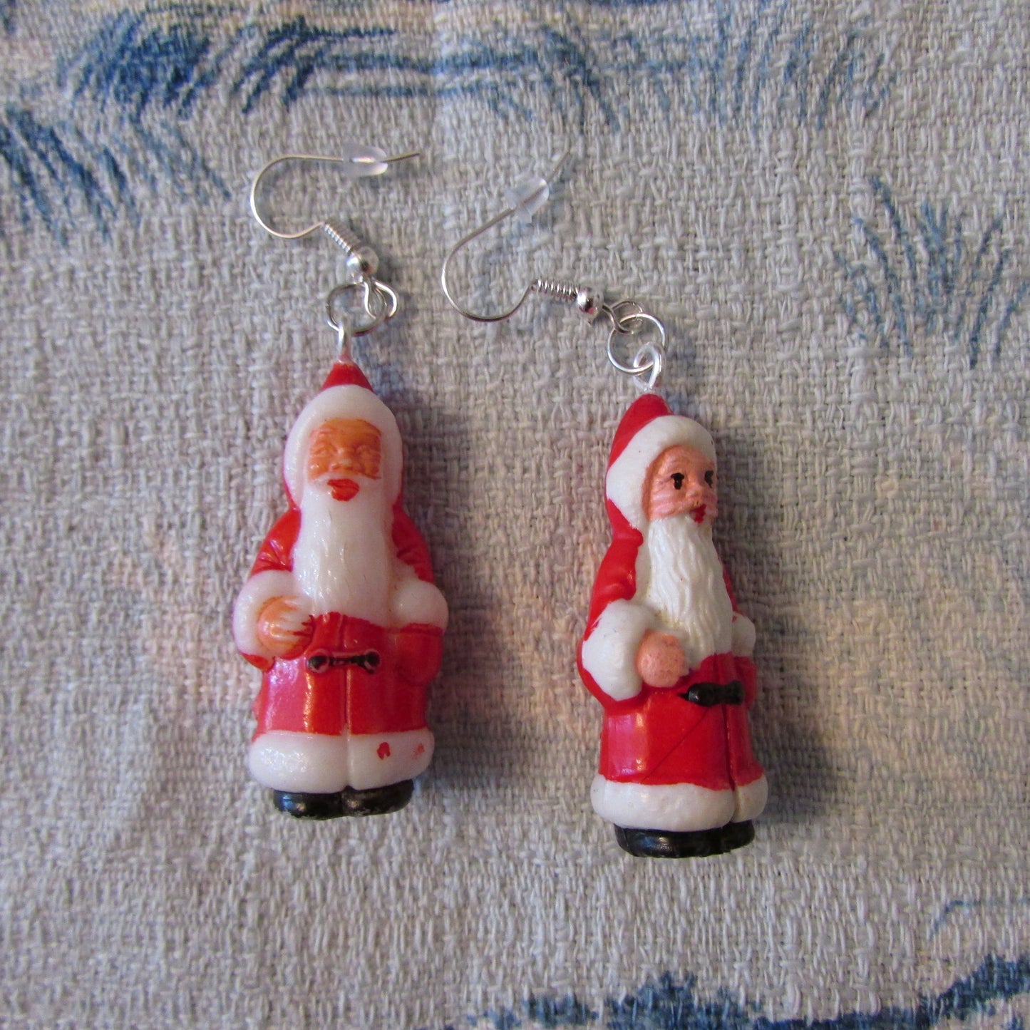 Kitsch home-made earrings made using vintage plastic Santa cake toppers