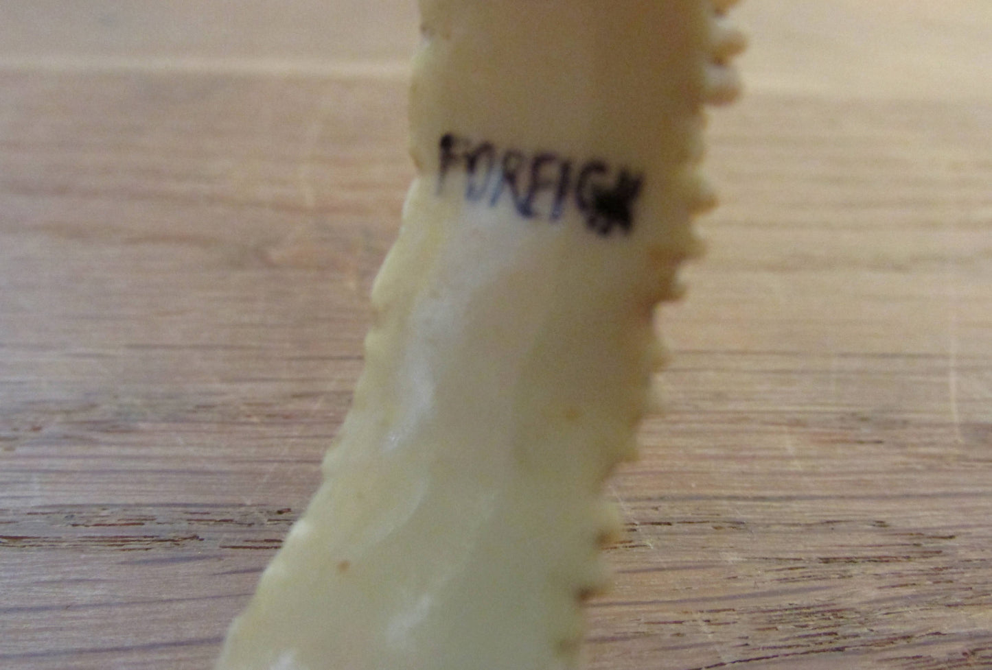 Art Deco carved floral resin/celluloid bangle, stamped Foreign