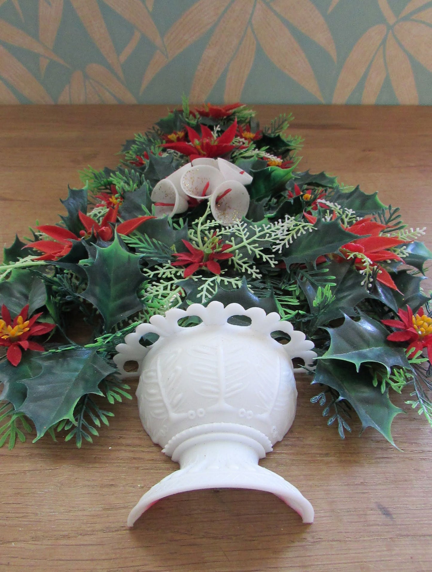 1970s plastic miniature wall-hanging Christmas tree festooned with Poinsettia