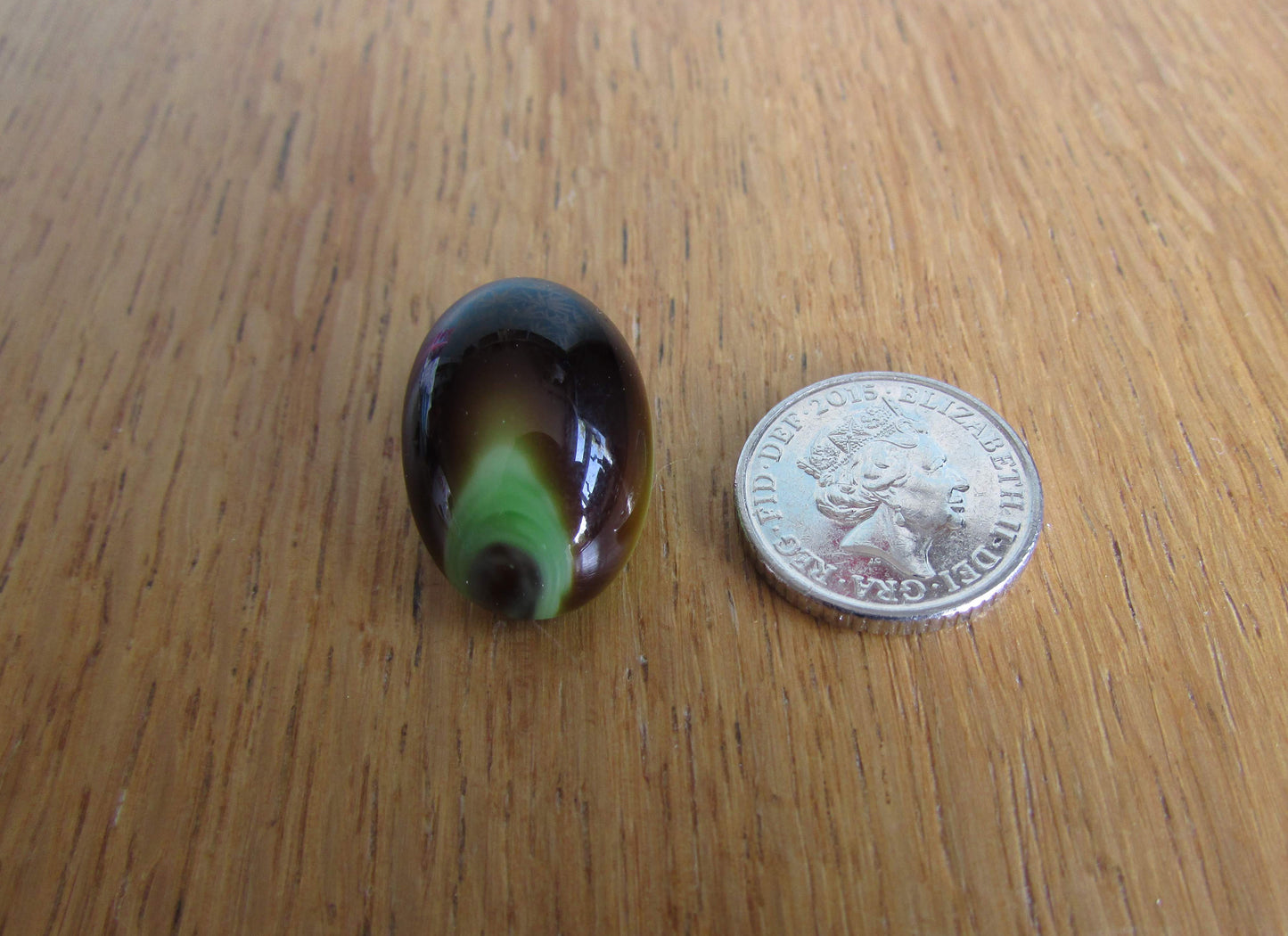 Vintage pastille-shaped peacock occelus-inspired glass clip-on earrings