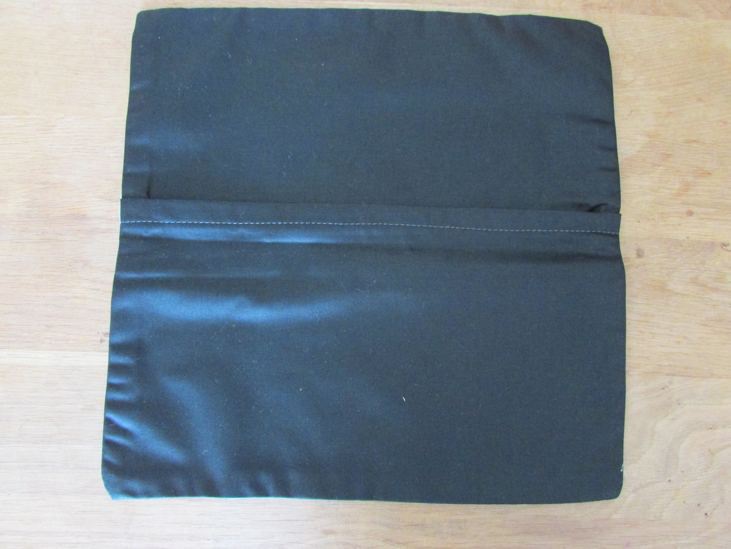 Home-made 1950s geometric pattern cushion cover with contrast black reverse