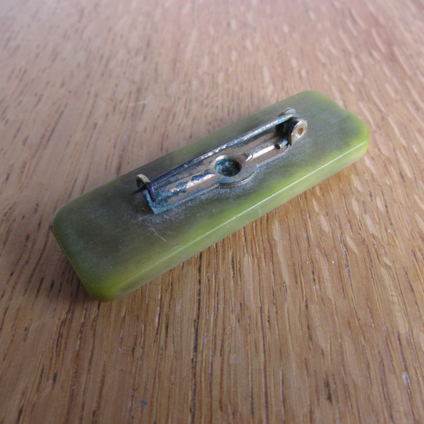 Art Deco olive green bevelled Bakelite solid rectangular bar brooch