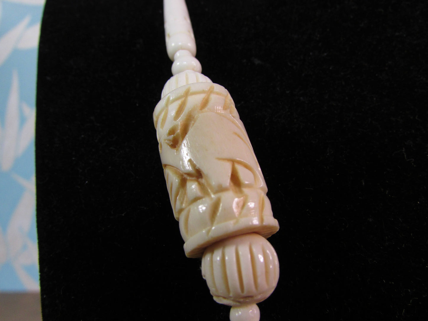 circa. 1970s ivory-tone bone necklace with carved animal detail