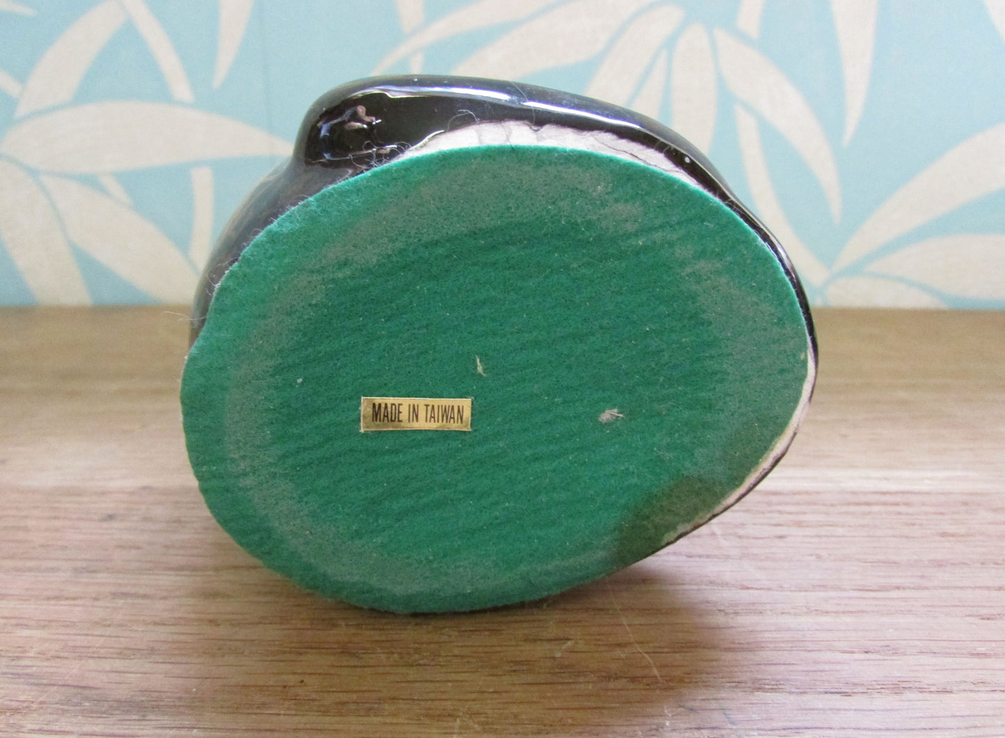 Pair of mid-century black ceramic mantel cats with green eyes