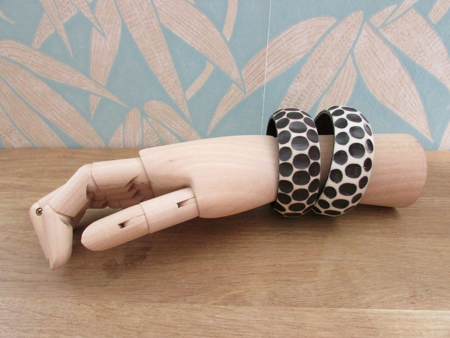 Pair of 1960s carved resin monochrome polka dot bangles