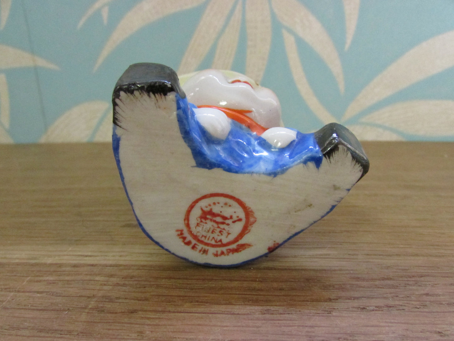 Vintage boy in yellow hat ceramic egg cup