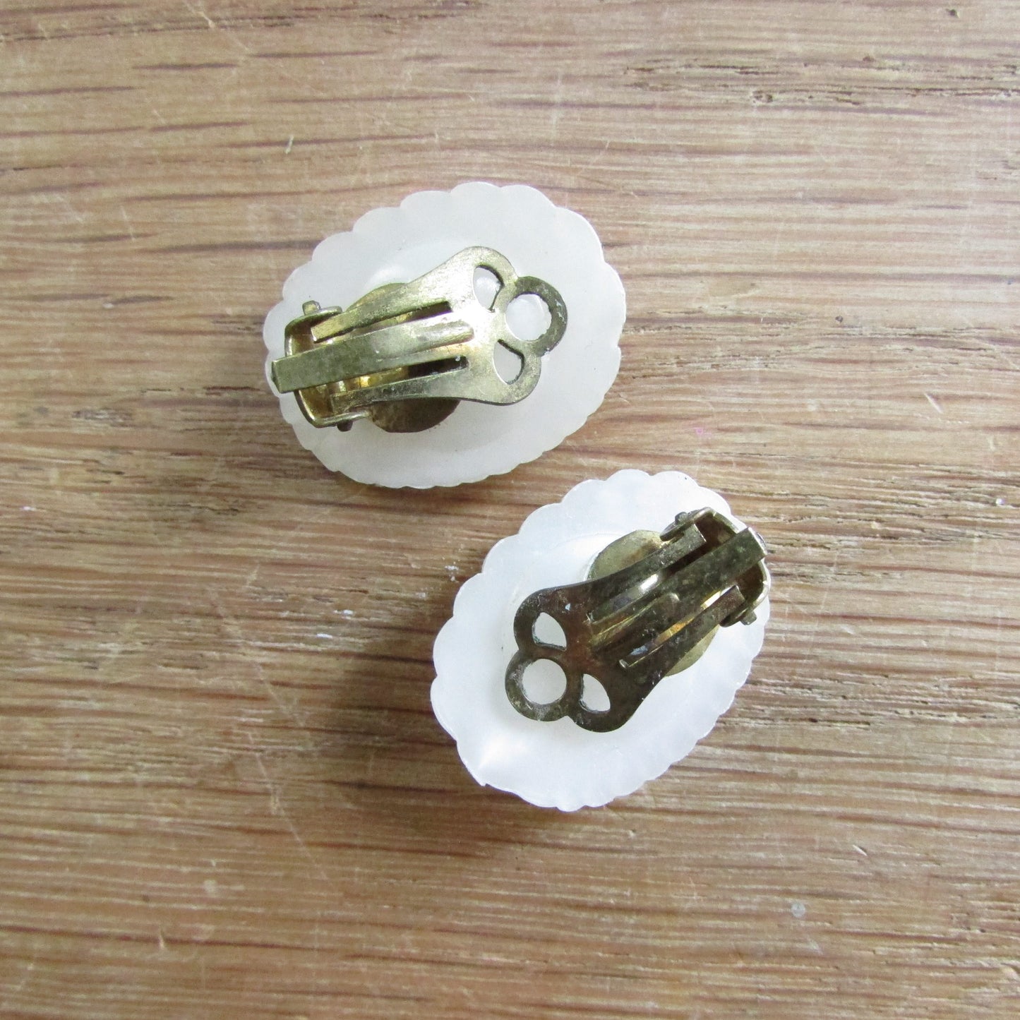 1950s/60s white shell style plastic clip-on earrings with blue rhinestones