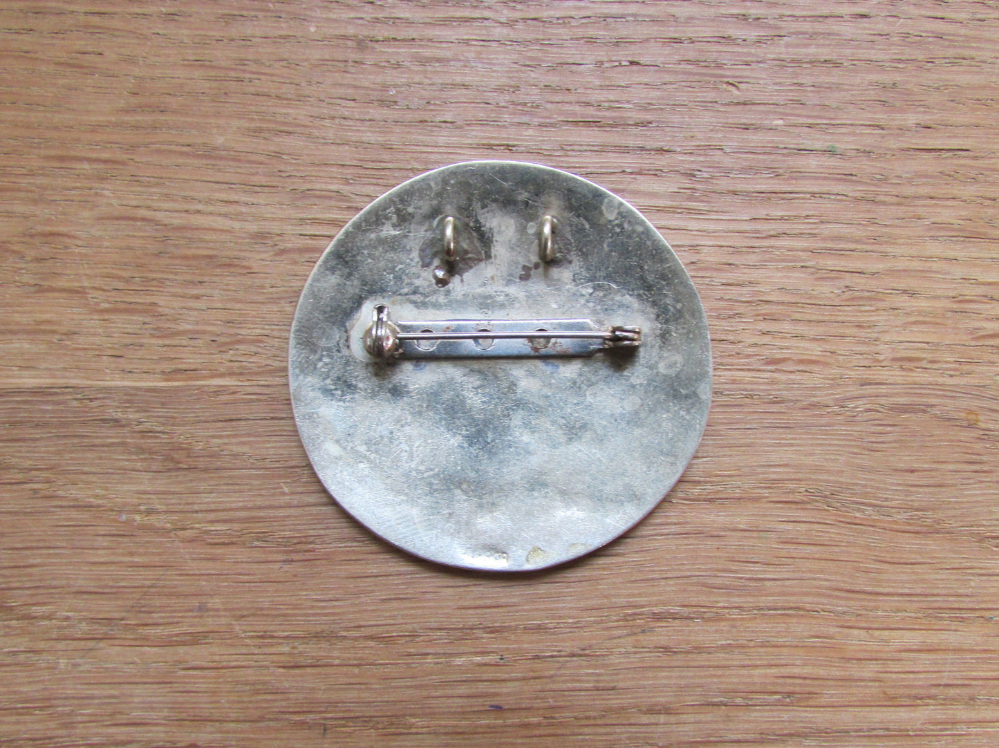 Vintage Aztec-style enamelled metal circle brooch/pendant, stamped ALPACA