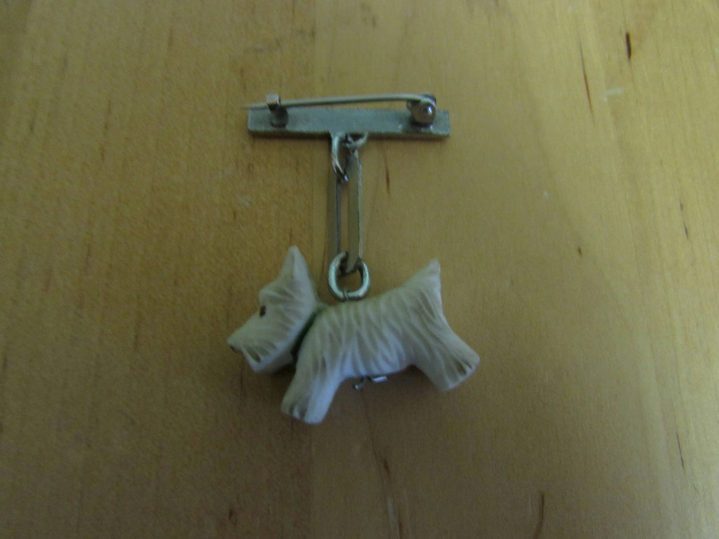 Art Deco silver-tone bar drop brooch with white celluloid Scottie dog