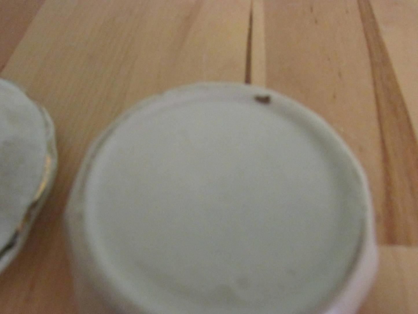 Vintage gilt edged porcelain powder jar with two dogs transfer detail