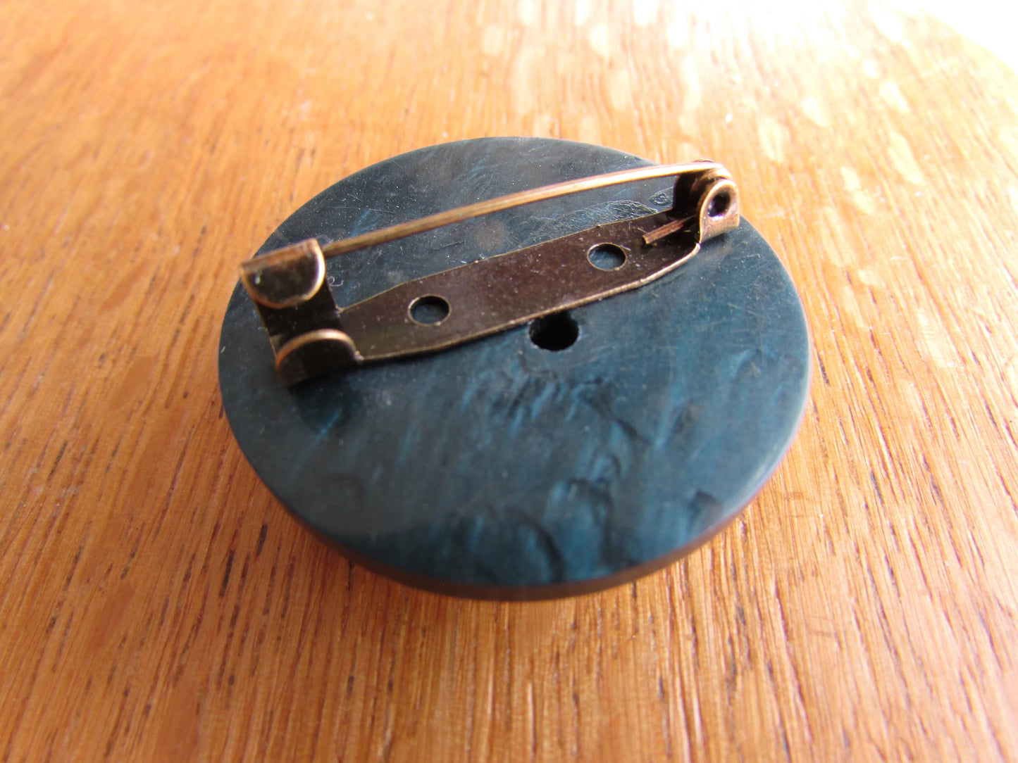 Home-made brooch using vintage plastic cocktail stirrer and vintage button