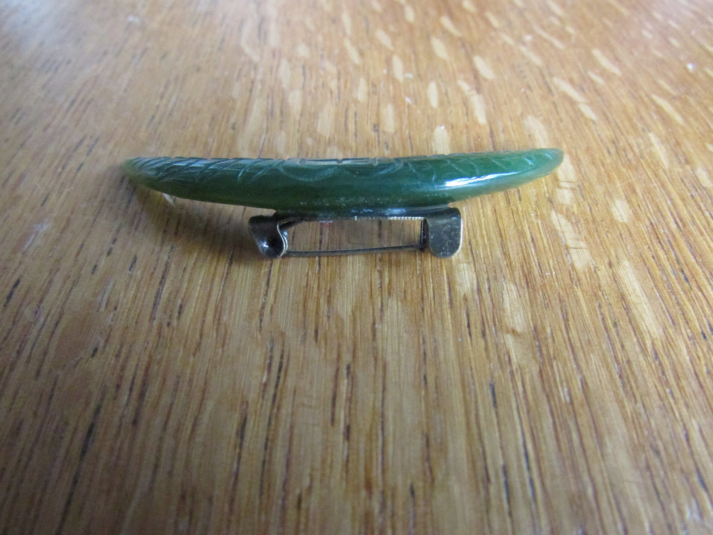 Home-made brooch using vintage carved jade crescent