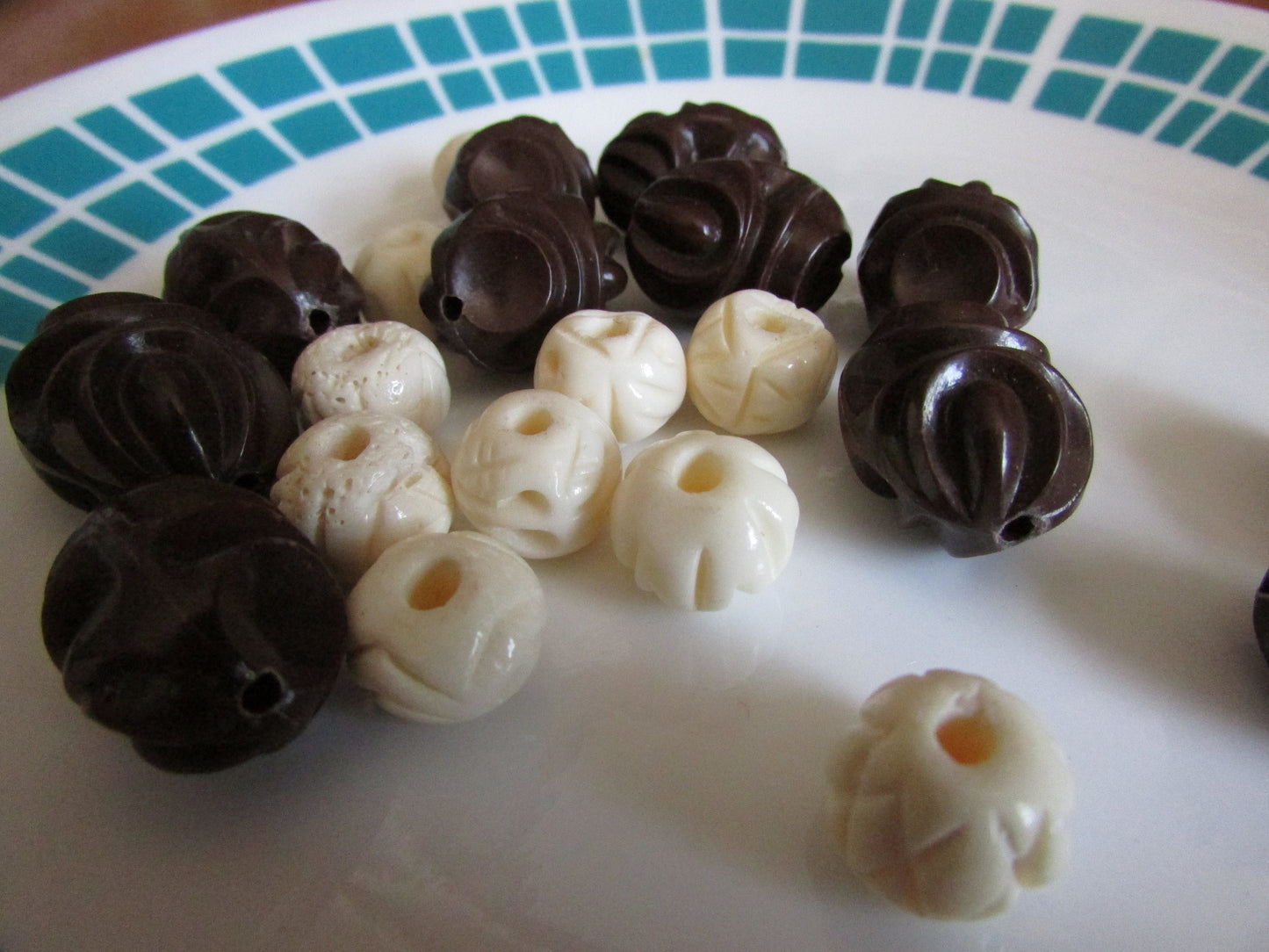 21 vintage large brown oval moulded, & cream/ivory round etched plastic beads