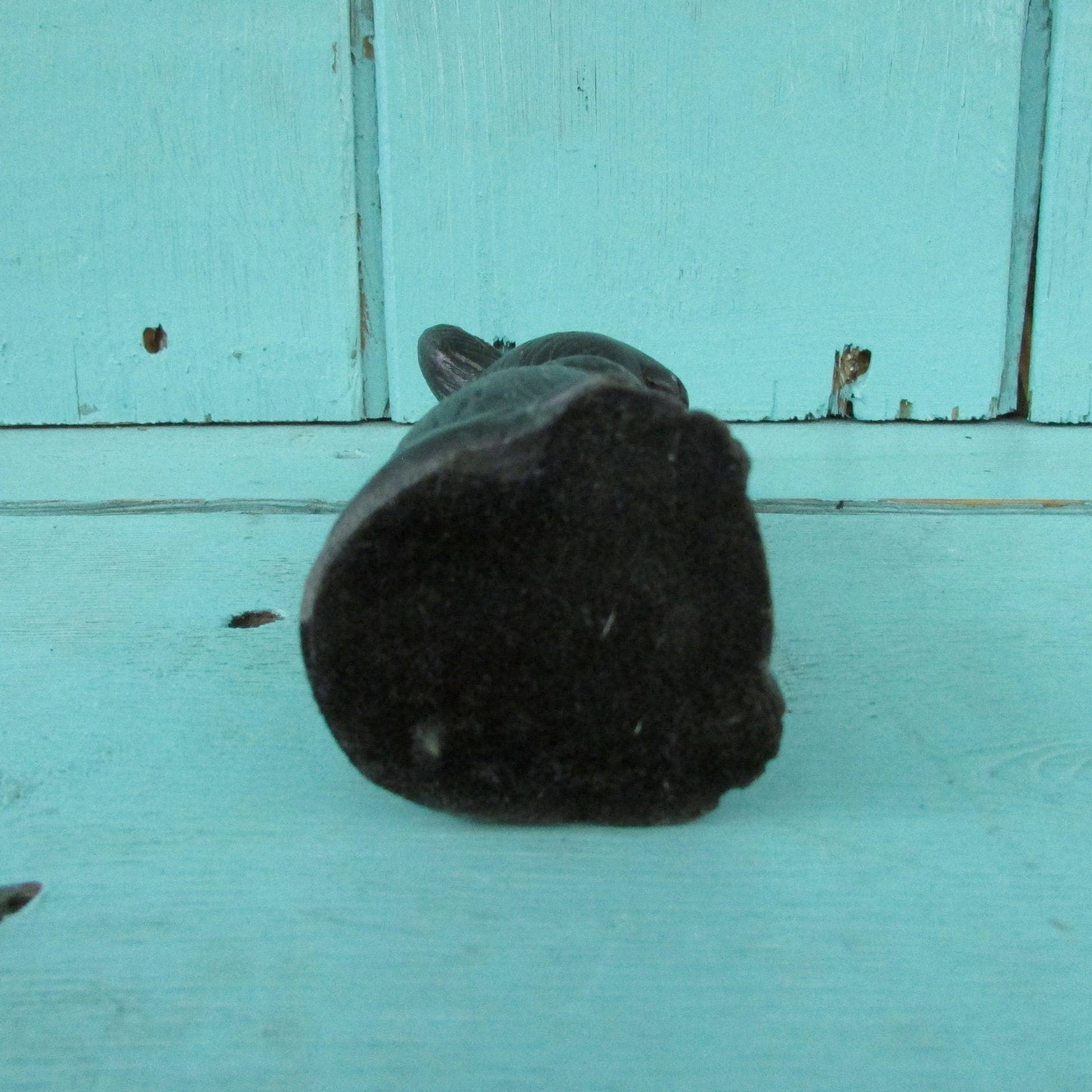 Vintage miniature coal rabbit figurine wearing apron