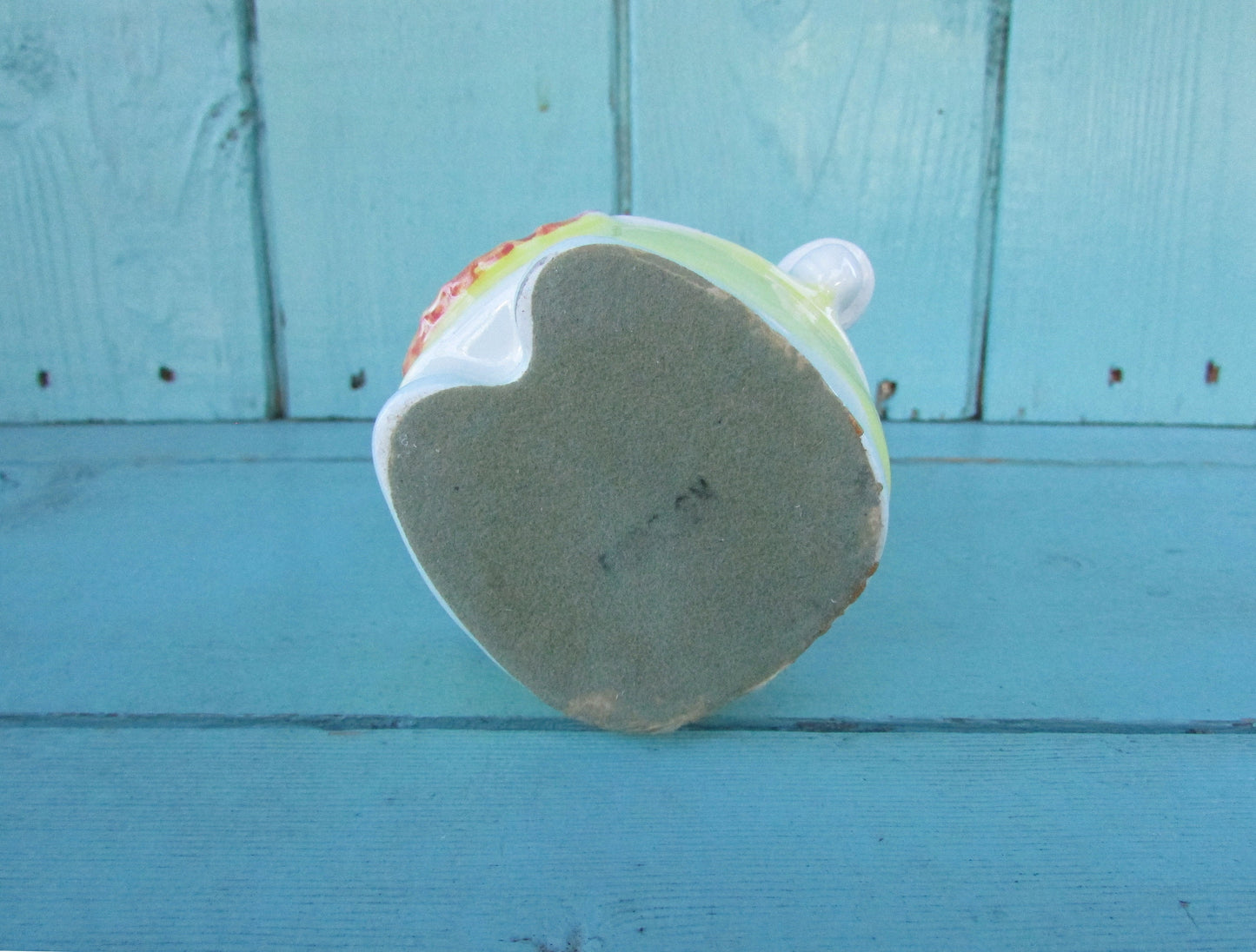 Vintage ceramic dog money box, with red hair bow detail, marked Foreign