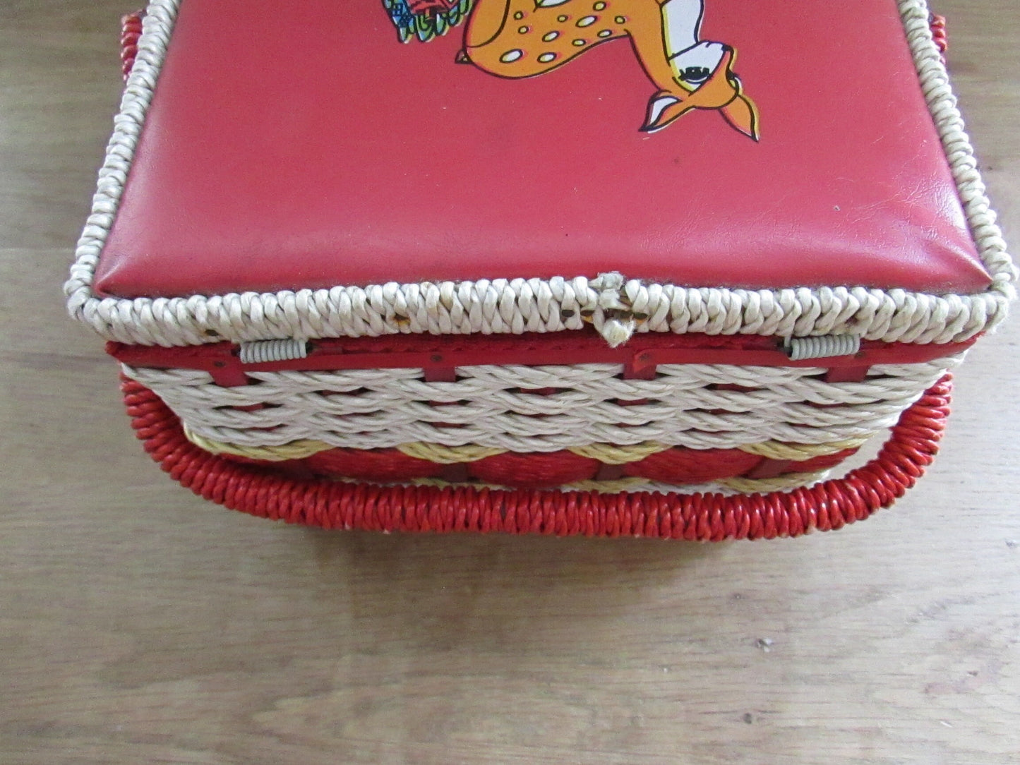 Mid-century red vinyl & wicker sewing box, depicting mother and baby deer