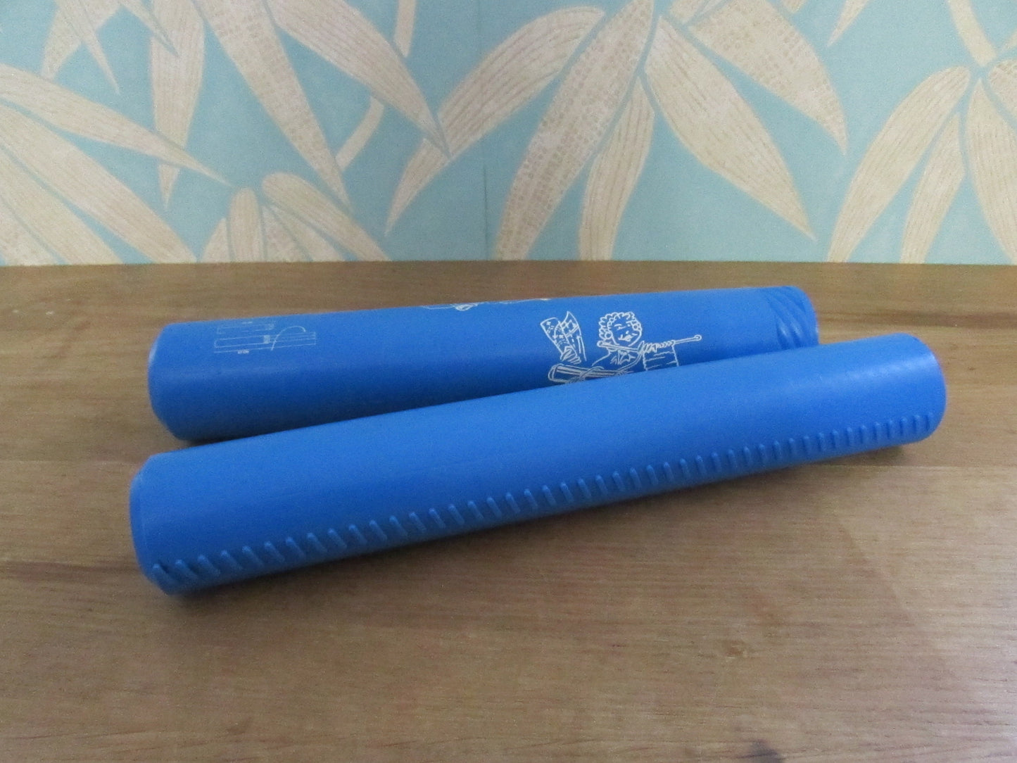 Vintage blue plastic certificate holder tube with cartoon motif