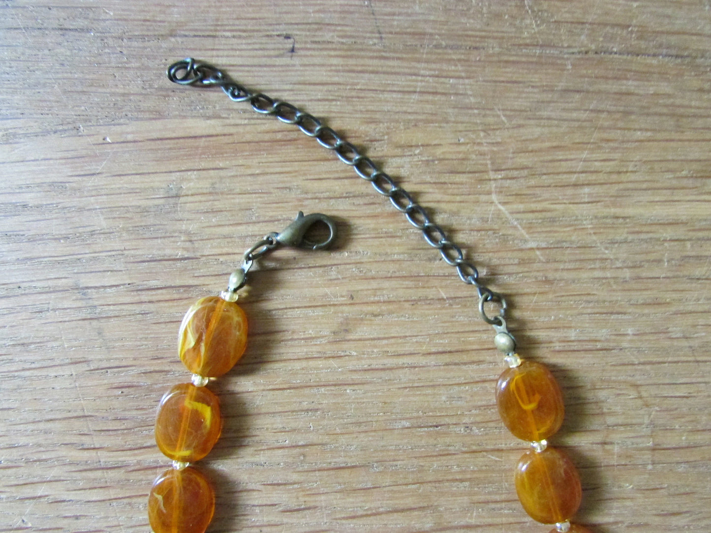 1960s amber effect marbled resin graduated oval bead necklace