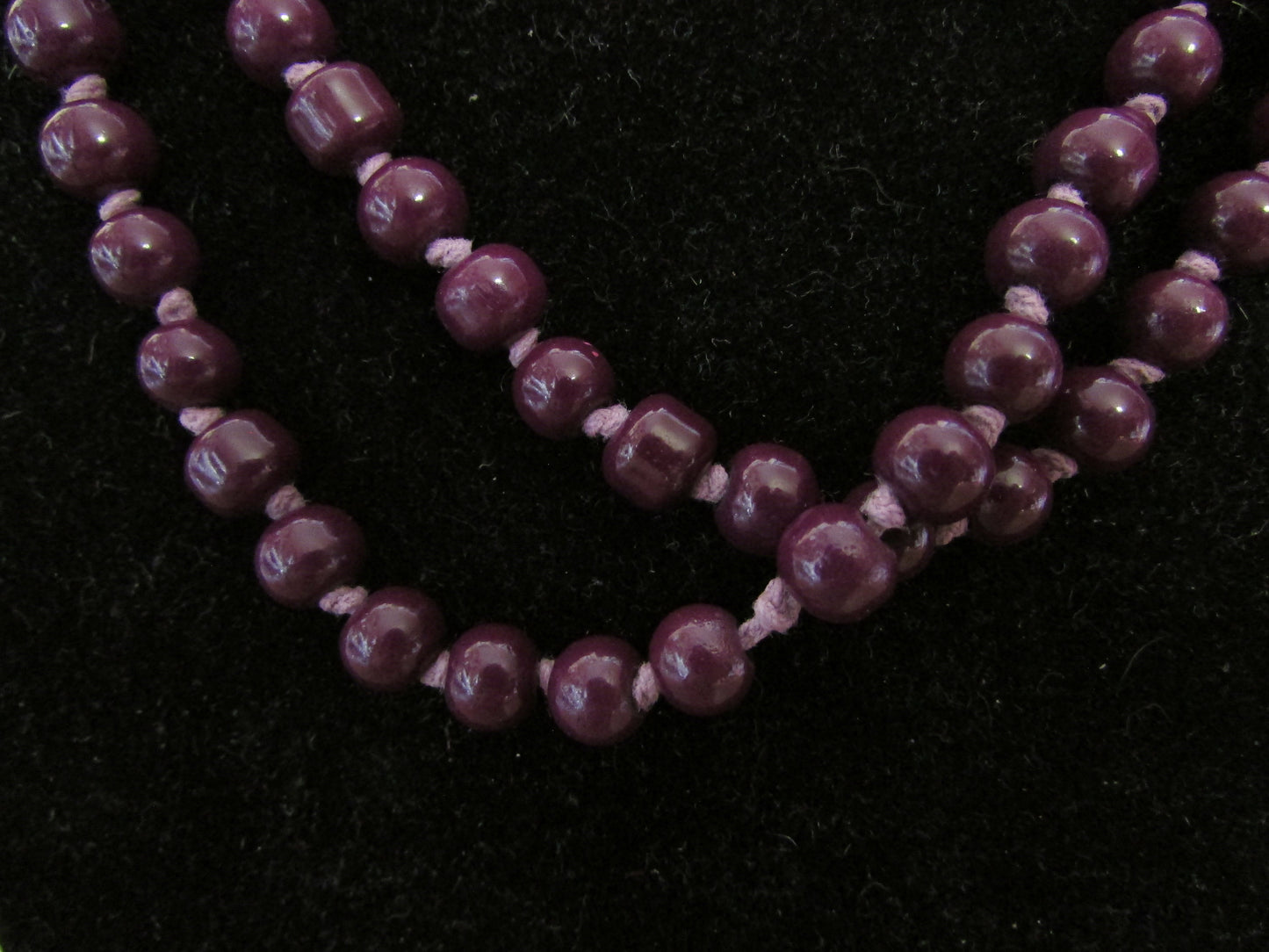 Vintage purple glass bead necklace, beads individually knotted