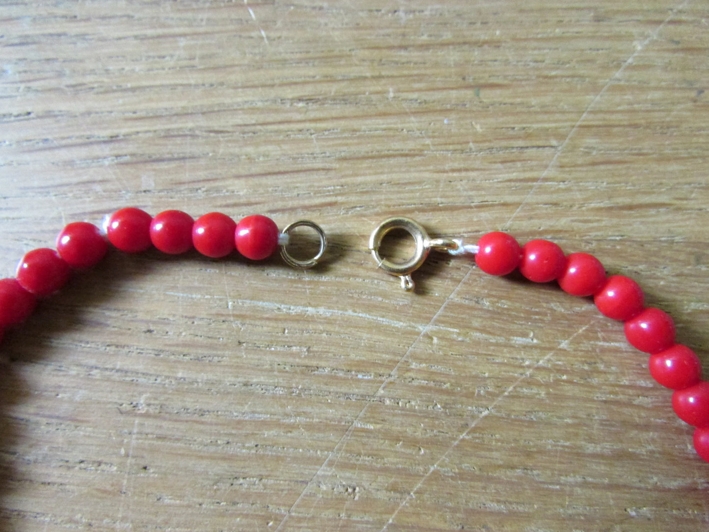 1960s cherry red flat graduating glass disc bead necklace
